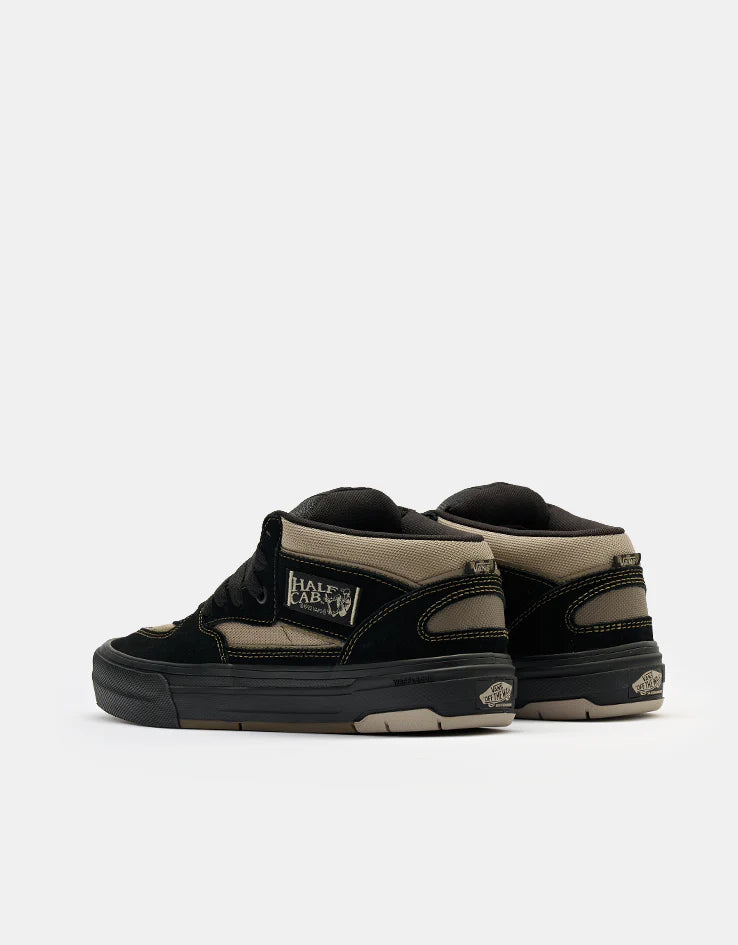 Vans Skate Half Cab Wafflecup shoes in black and peyote with skate-inspired design and textured rubber outsole.