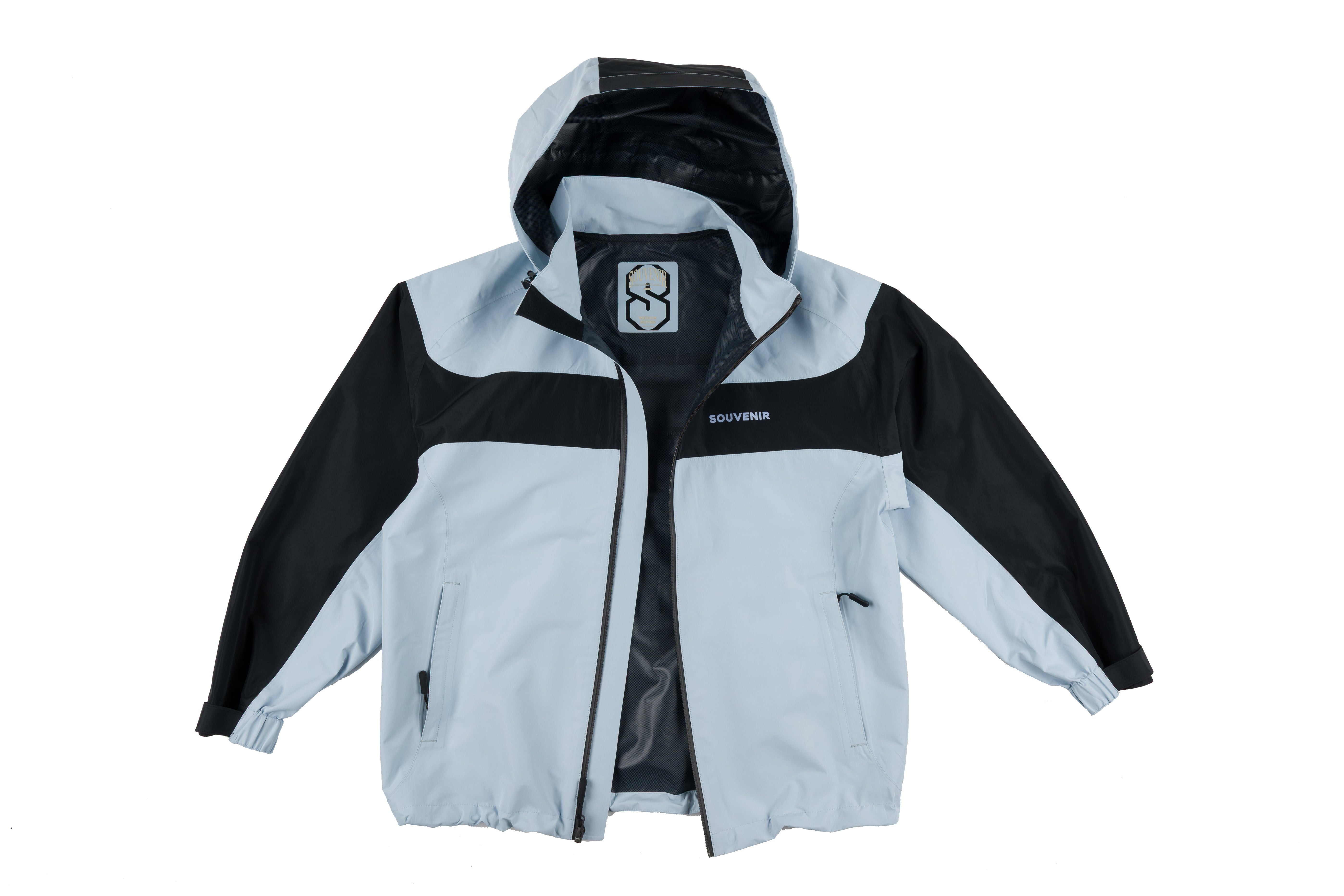 Souvenir 2.5 Ply Jacket 2027 for men and women, displayed in black with front zipper and hood, suitable for casual wear.