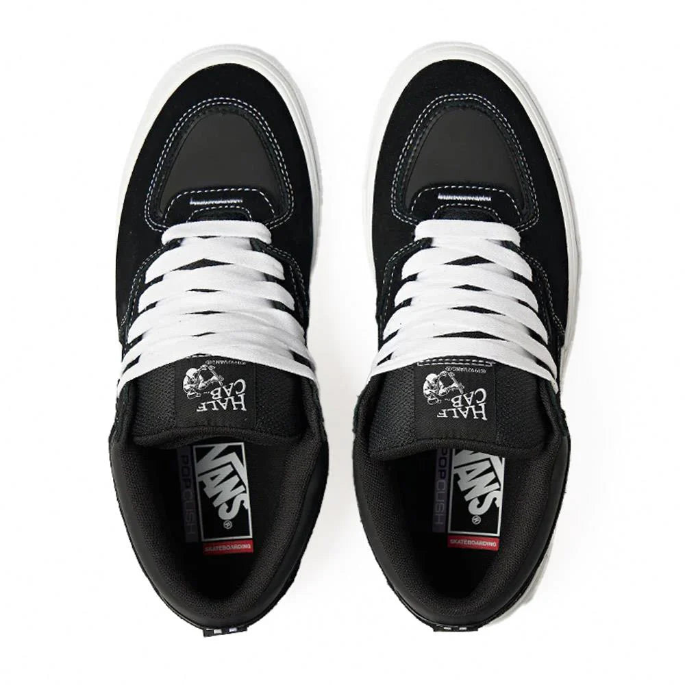 Vans Skate Half Cab Wafflecup shoes in black and white with classic skateboarding style and durable waffle outsole.