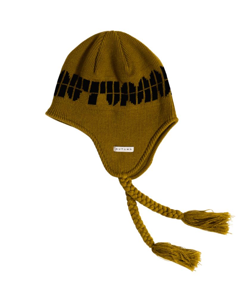 Autumn soy ear flap beanie for men and women, cozy knit hat with ear flaps in a warm autumn color.