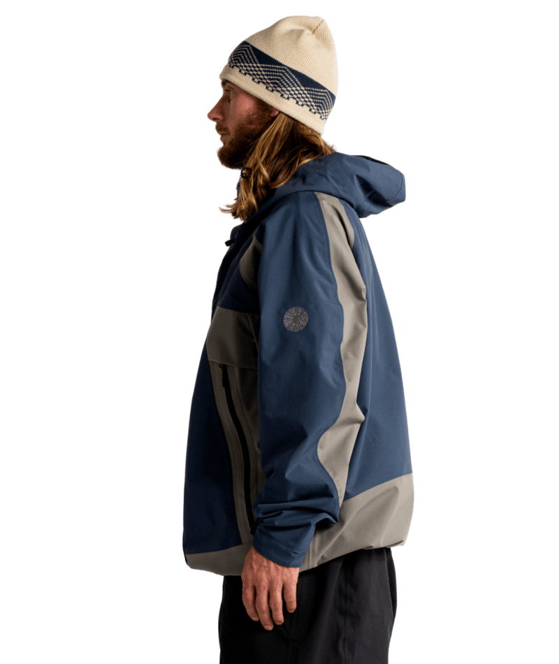 Autumn Crest 3L snow jacket for men and women, insulated winter outerwear in vibrant colors with a hood and snowy landscape background.