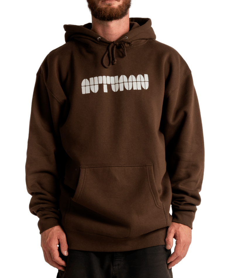 Autumn Soy Font Hooded Fleece in black, unisex, featuring a large graphic print on the front and a cozy hooded design.