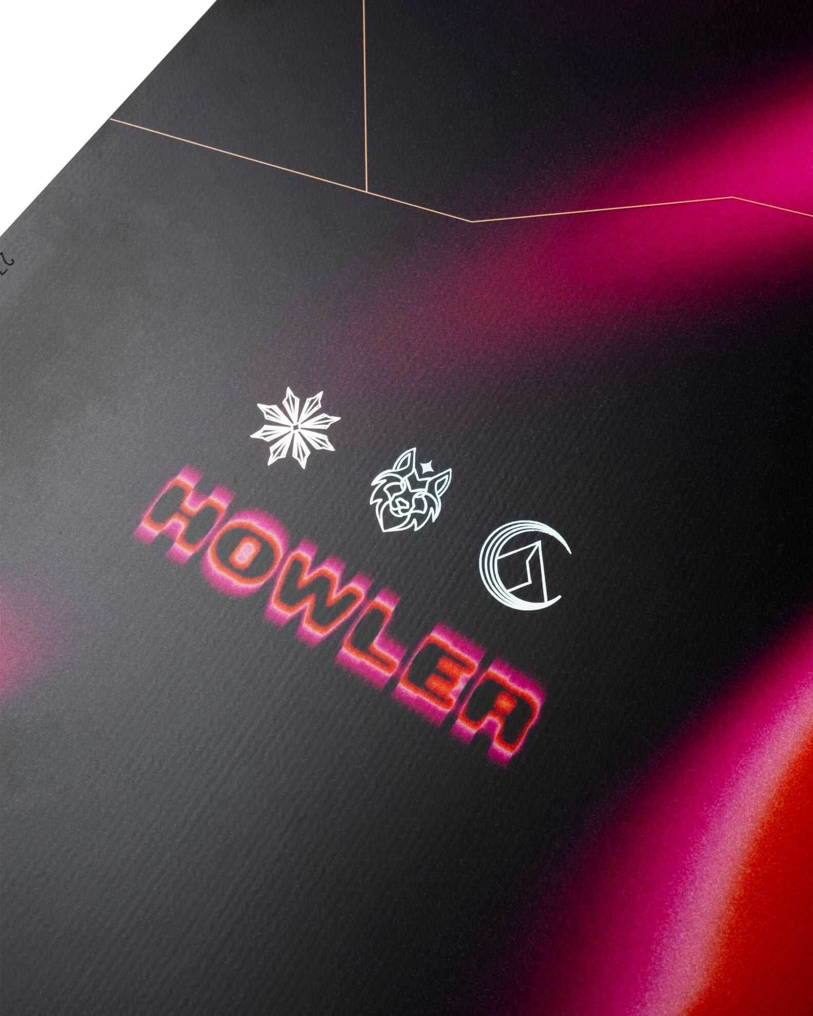 Close-up of Jones Women's Howler Snowboard 2027 showing the snowboard's graphic and brand logo on the top surface.
