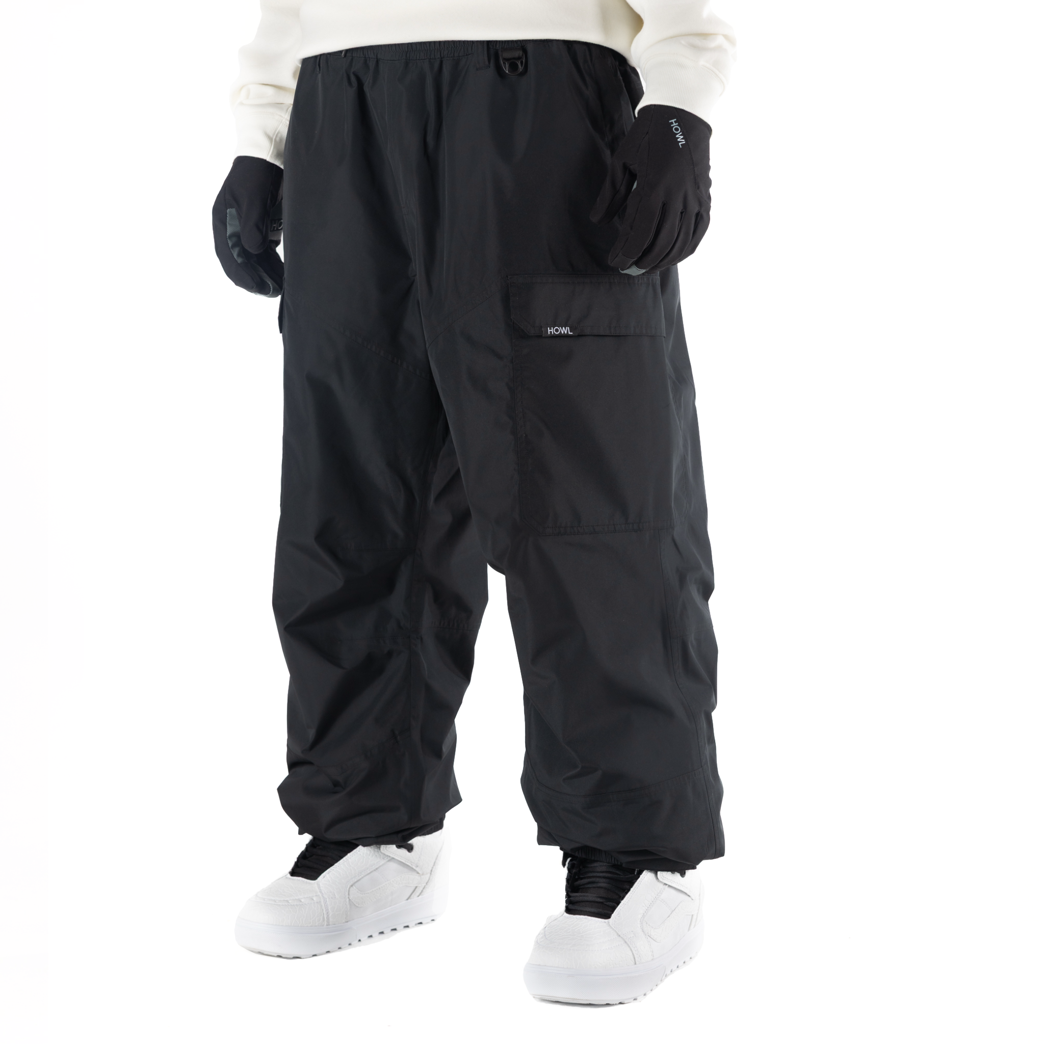 Black Howl insulated cargo pant for men and women, featuring multiple pockets and durable fabric for outdoor wear.