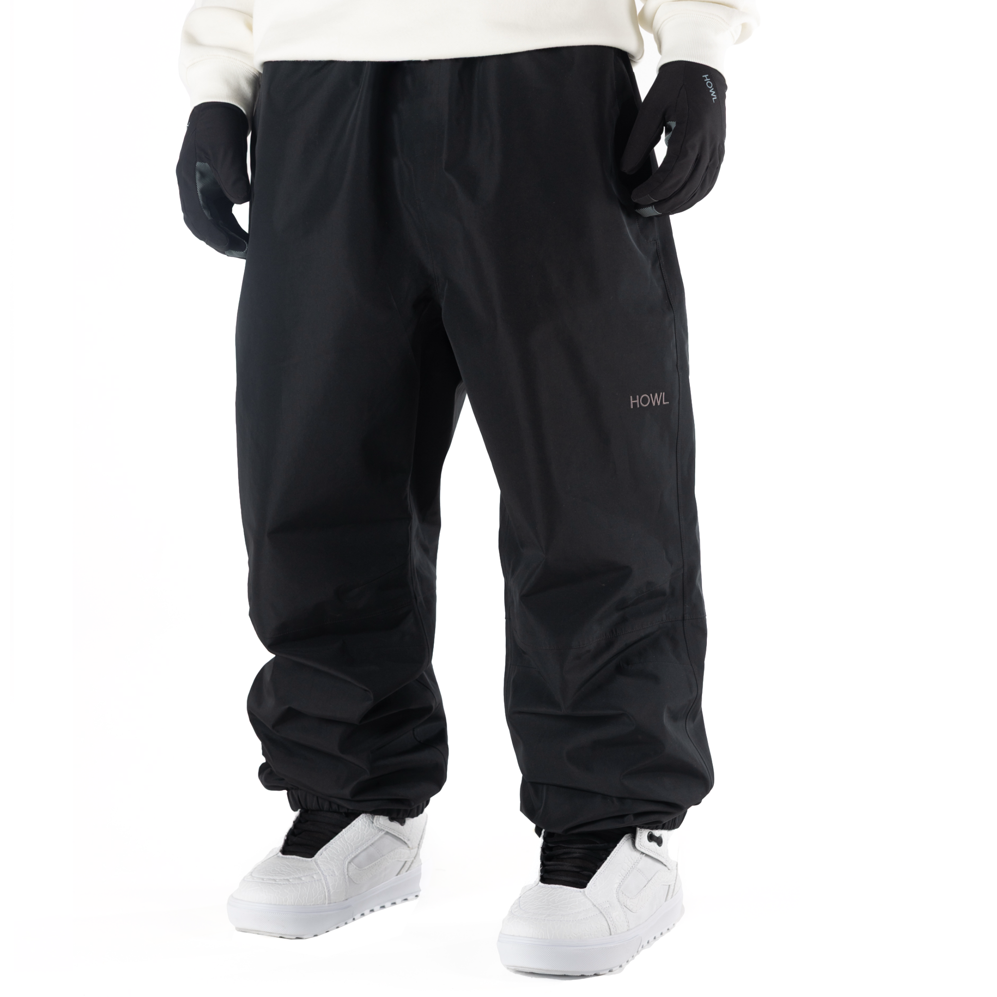 Black Howl Nowhere Pant for men and women, showing a relaxed fit with adjustable waistband and stylish design.