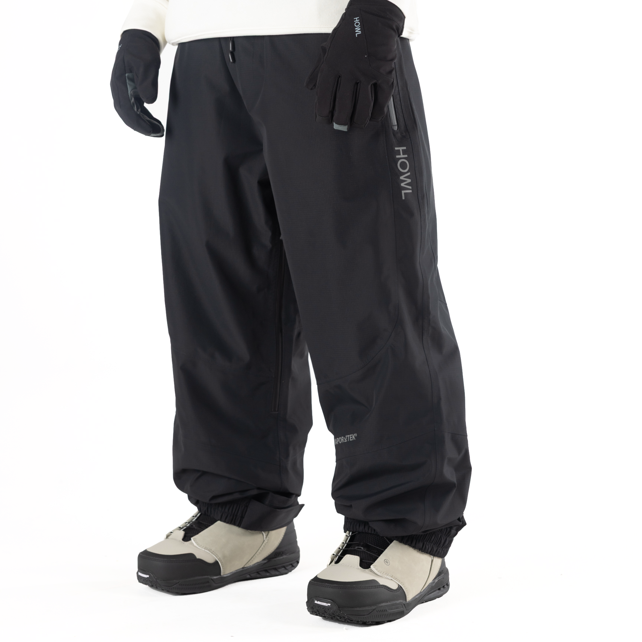 Black Howl Shell Pant for men and women, featuring a sleek waterproof shell design suitable for outdoor activities.