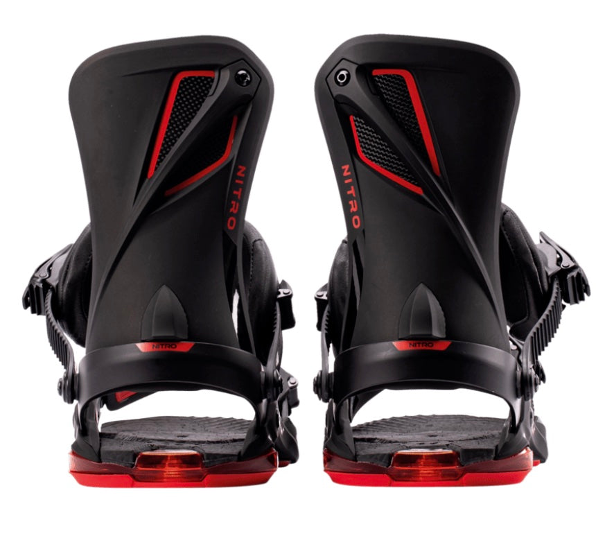 Nitro Phantom+ snowboard bindings mounted on a snowboard, featuring adjustable straps and high-performance design for snowboarding.