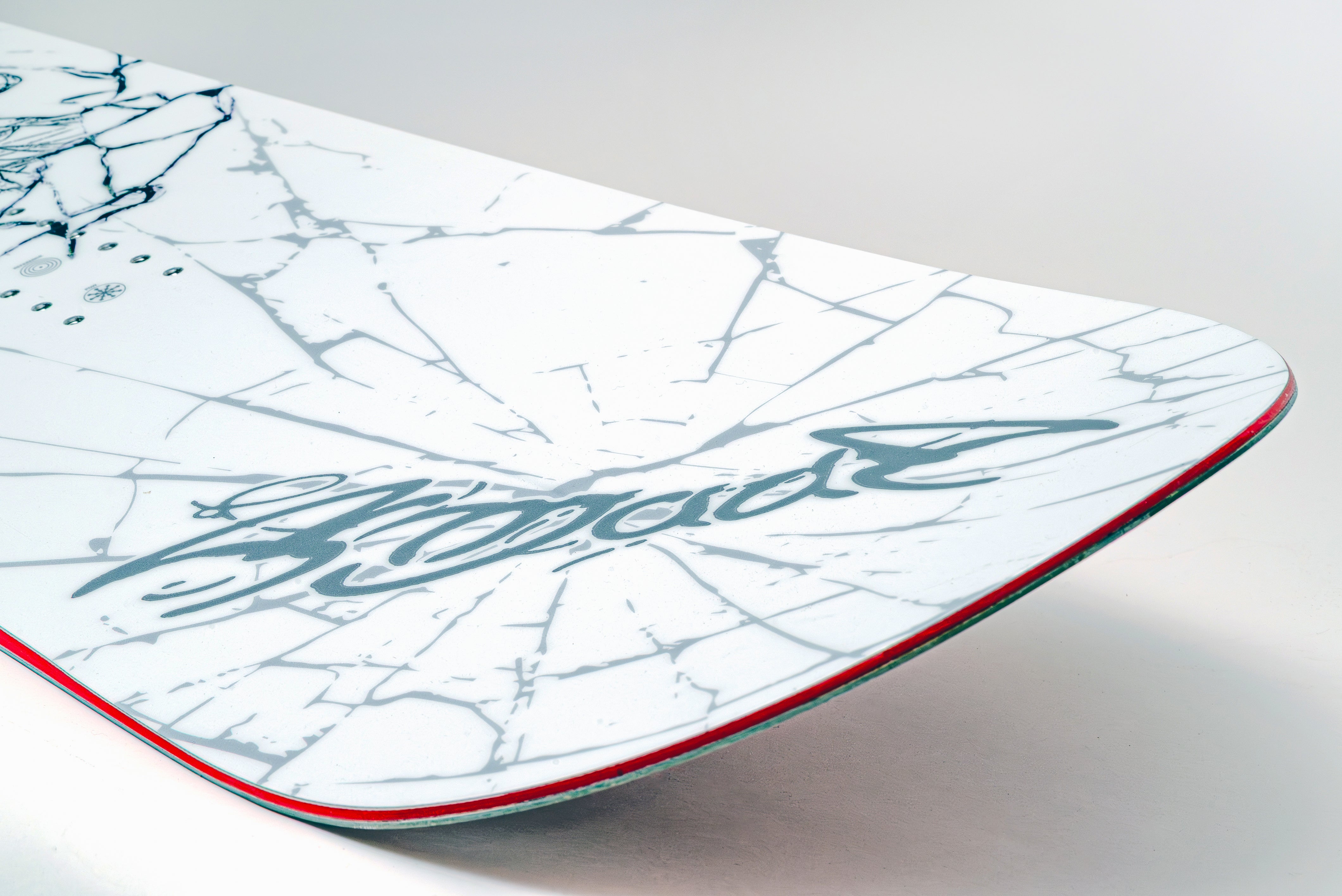 Tail of the Armada Beatnik snowboard, showing the early-rise rocker and tail branding.