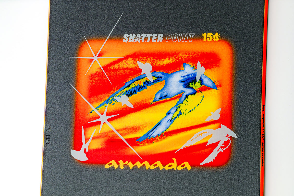 Armada Shatter Point snowboard with detailed topsheet design, showcasing its center graphic and sleek winter sports style.