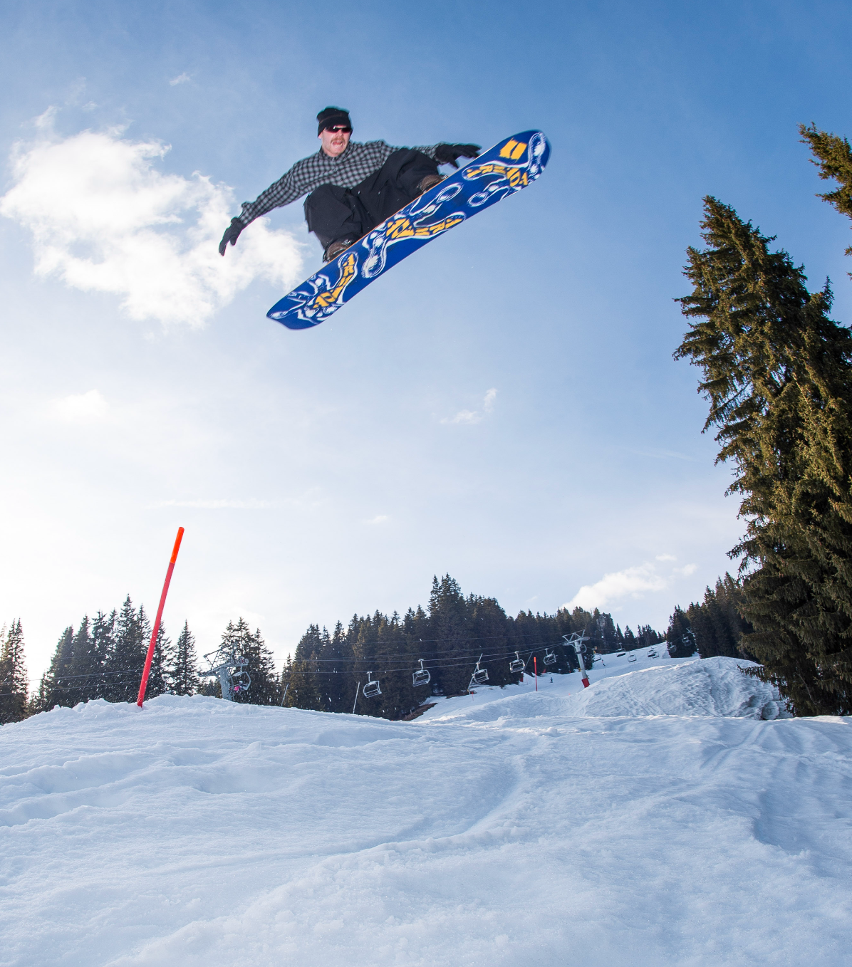 Armada Sicko Snowboard 2027 with Alek Air design, featuring a sleek snowboarding image with vibrant graphics and dynamic stance.