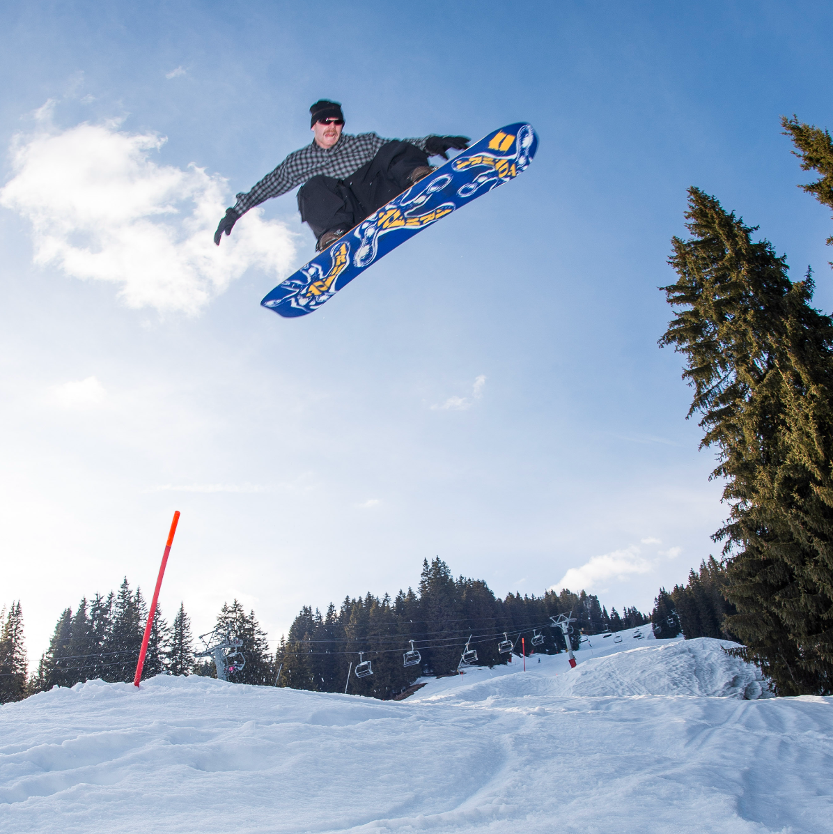 Armada Sicko Snowboard 2027 with Alek Air design, featuring a sleek snowboarding image with vibrant graphics and dynamic stance.