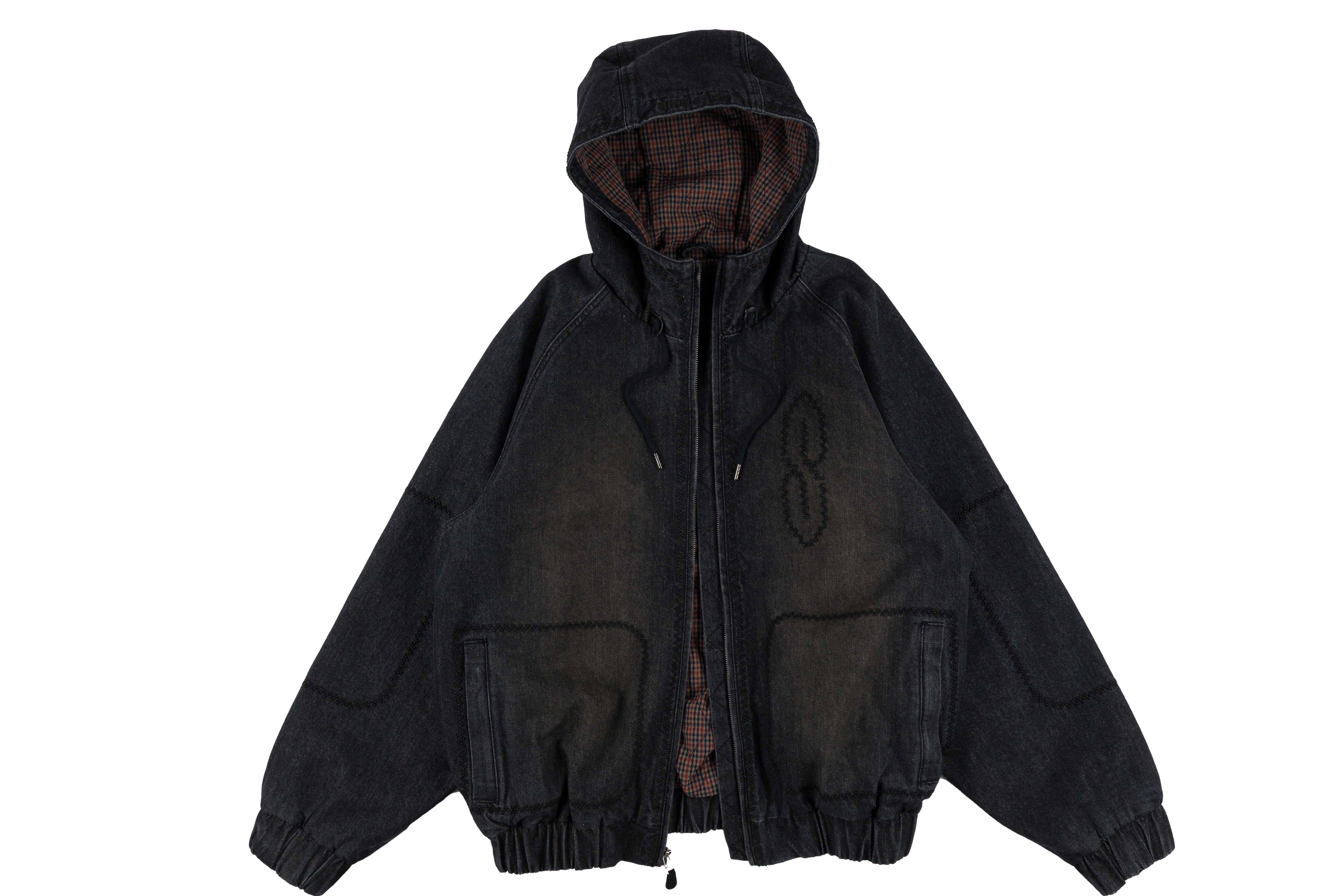 Souvenir denim bomber jacket for men and women, featuring classic design and stylish fit, shown in a close-up view.