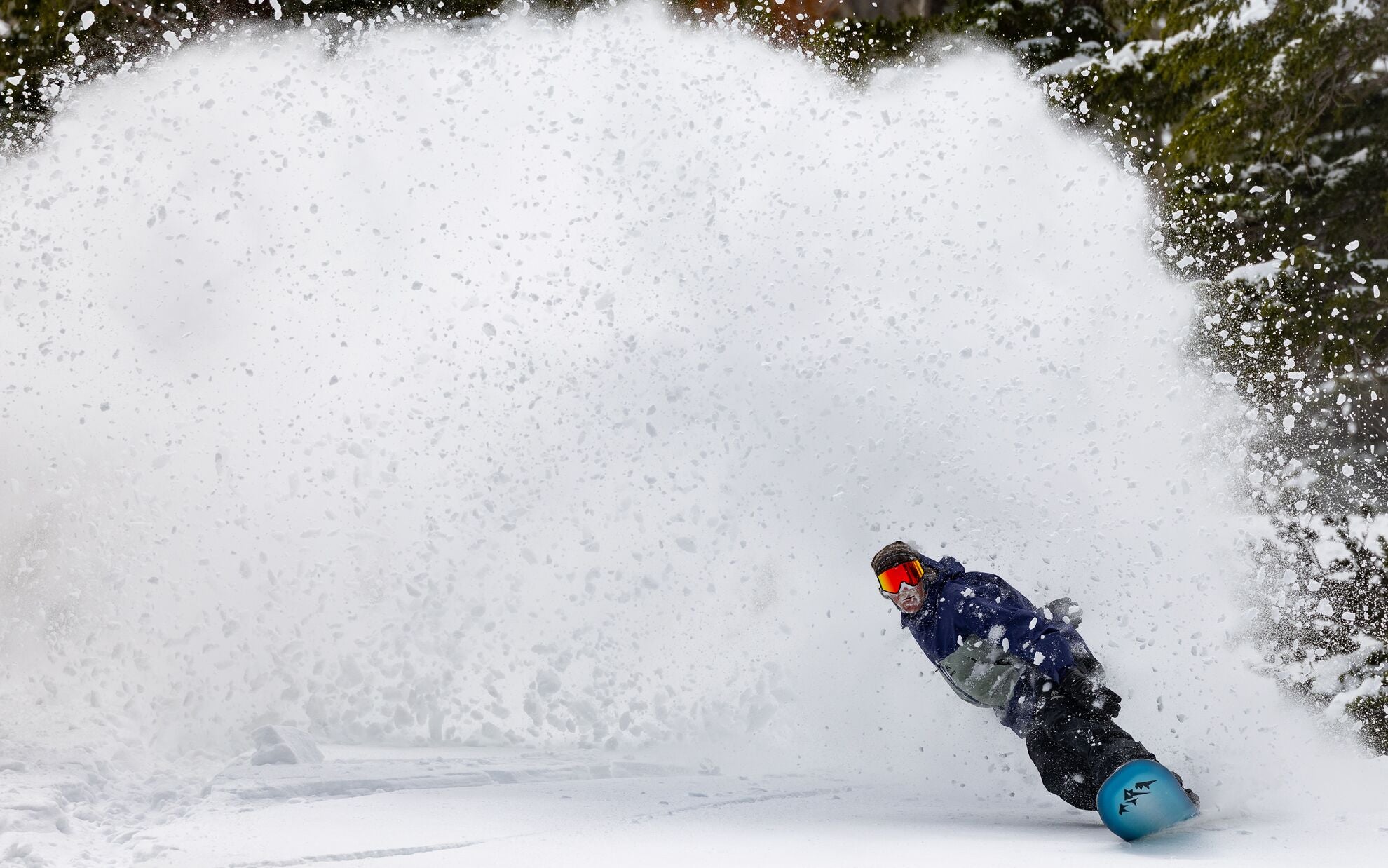 Jones Mind Expander 2 snowboard in action, showcasing its versatile design and snow-ready features for all-mountain riding.