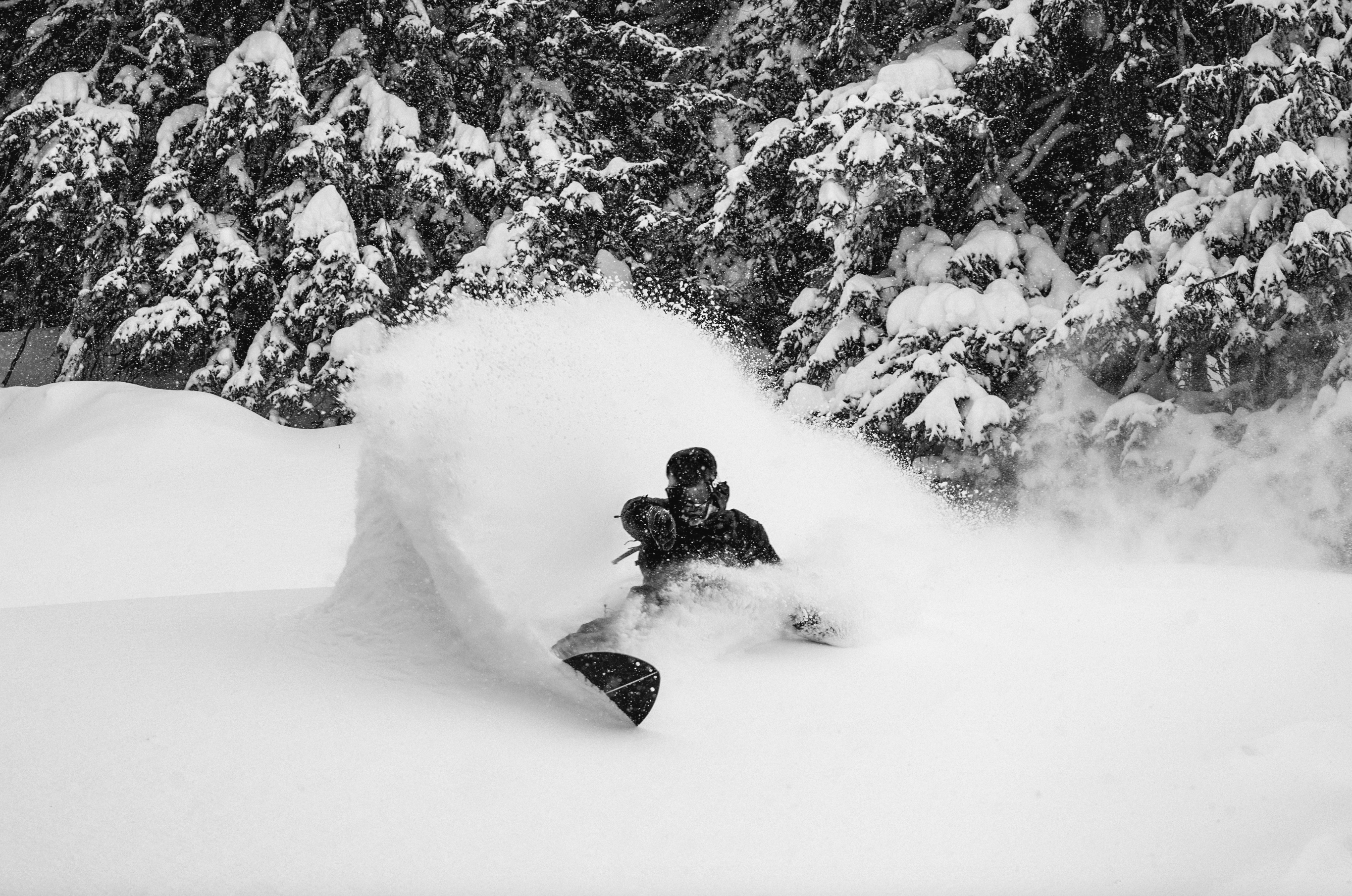 Korua Dart Split Snowboard in snowy mountain setting, showcasing its split design and durable construction for winter snowboarding.