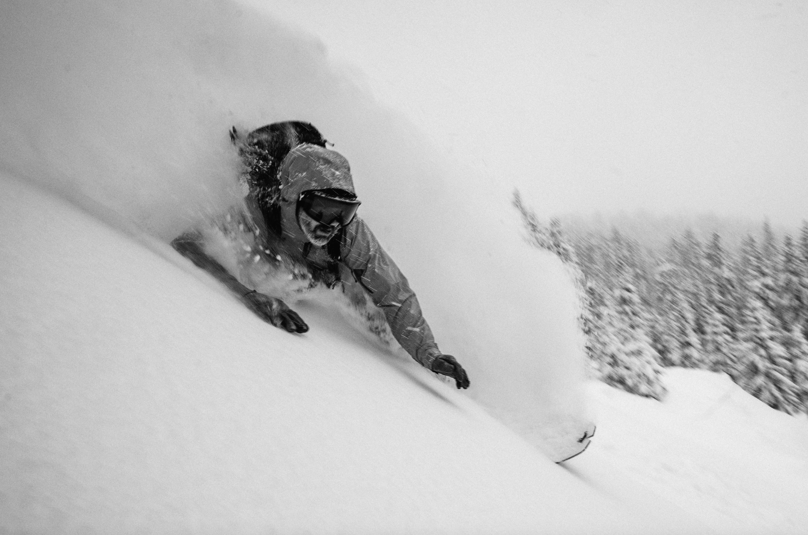Korua Elevator Split Plus snowboard in deep snow, showcasing its split design and durable construction for versatile winter snowboarding.