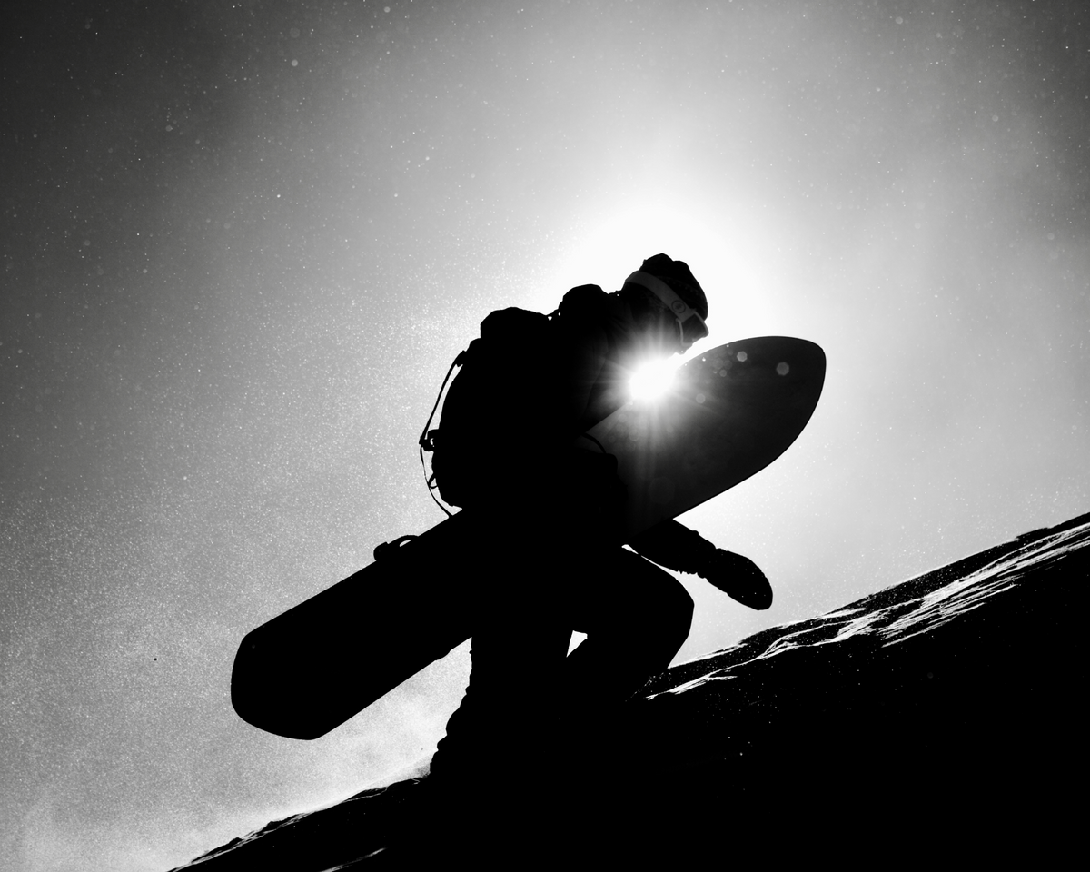 Korua Pin Tonic Snowboard on snow, showcasing its shape and design, ideal for winter snowboarding enthusiasts.