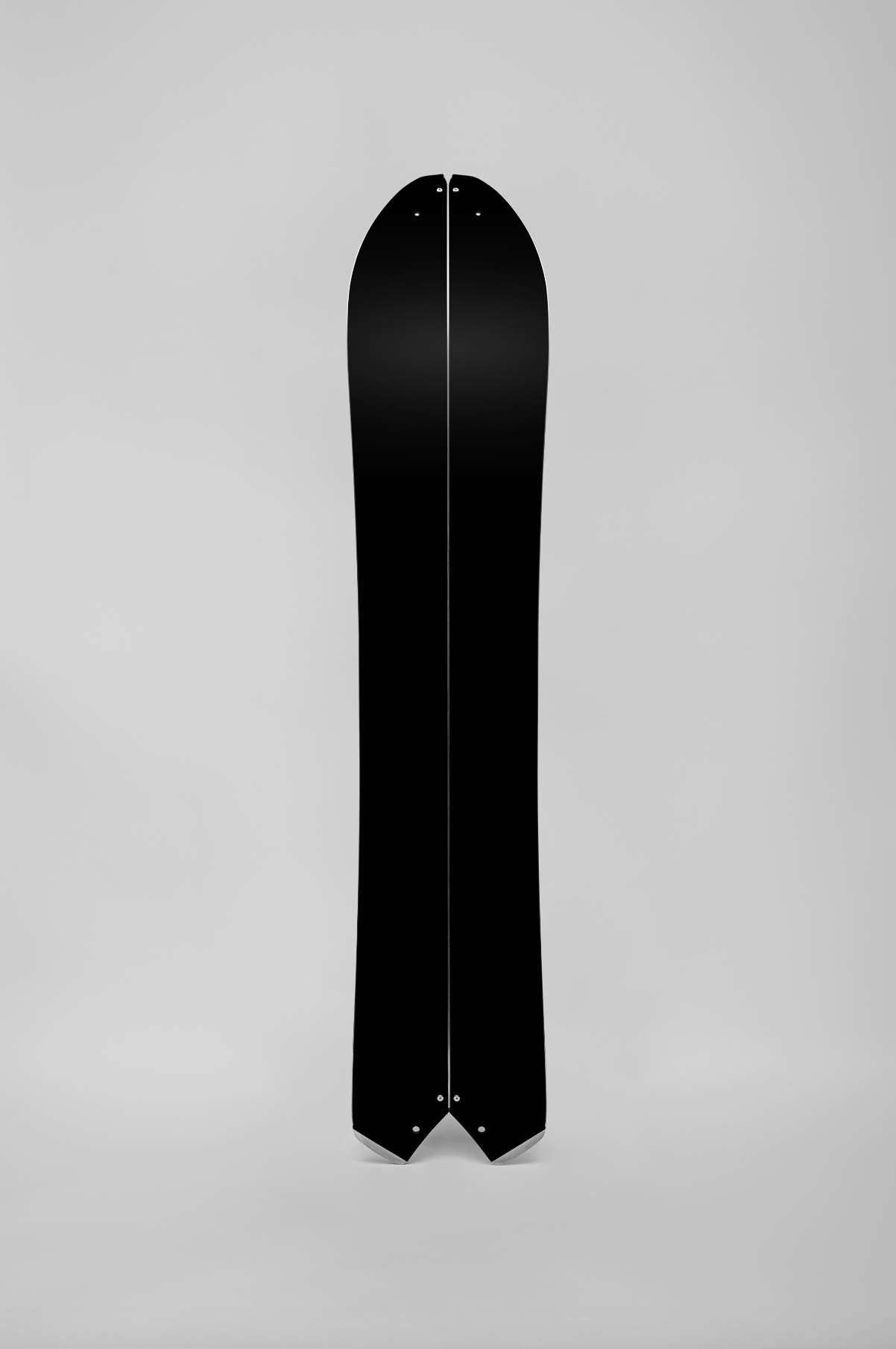 Korua Quill Split Snowboard base detail, showcasing the snowboard's design and construction for split snowboarding.