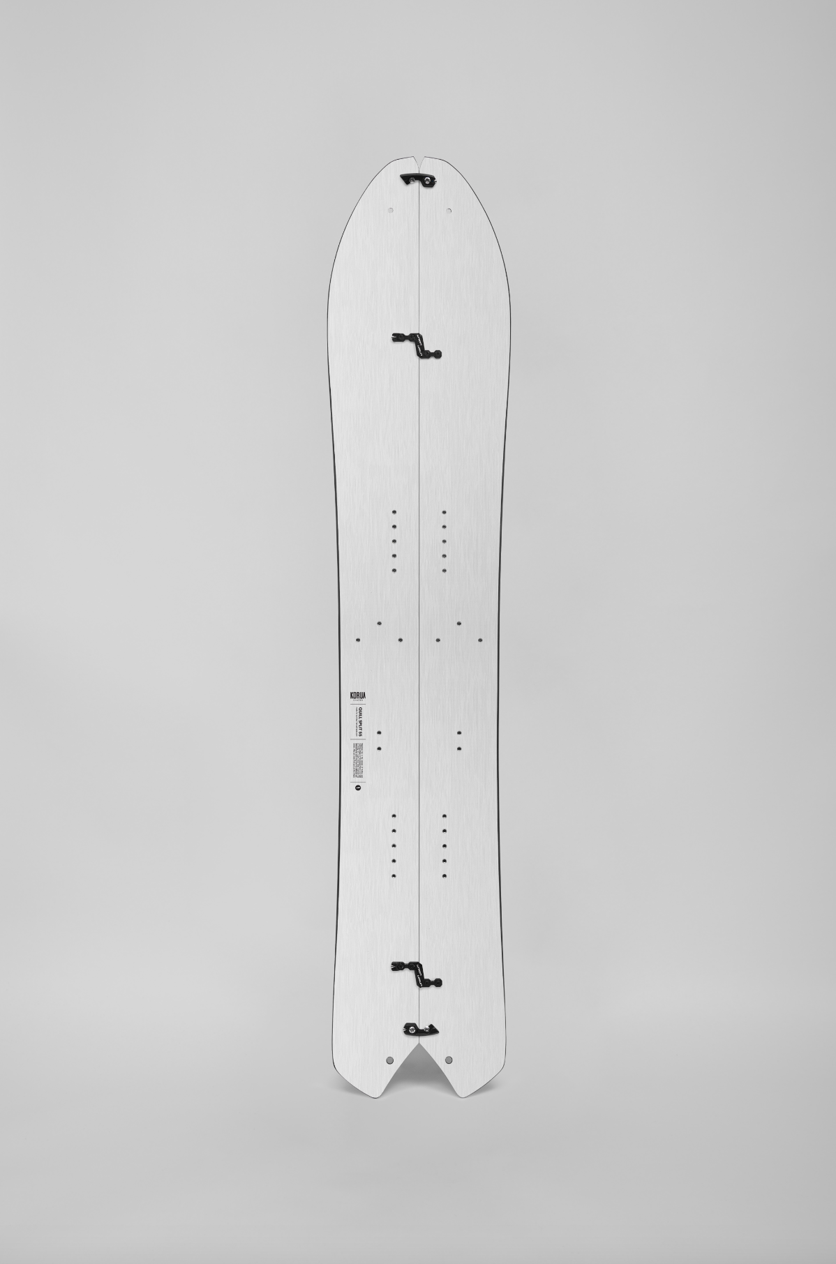 Korua Quill Split Snowboard shown outdoors, highlighting its split design and durable construction for backcountry snowboarding.
