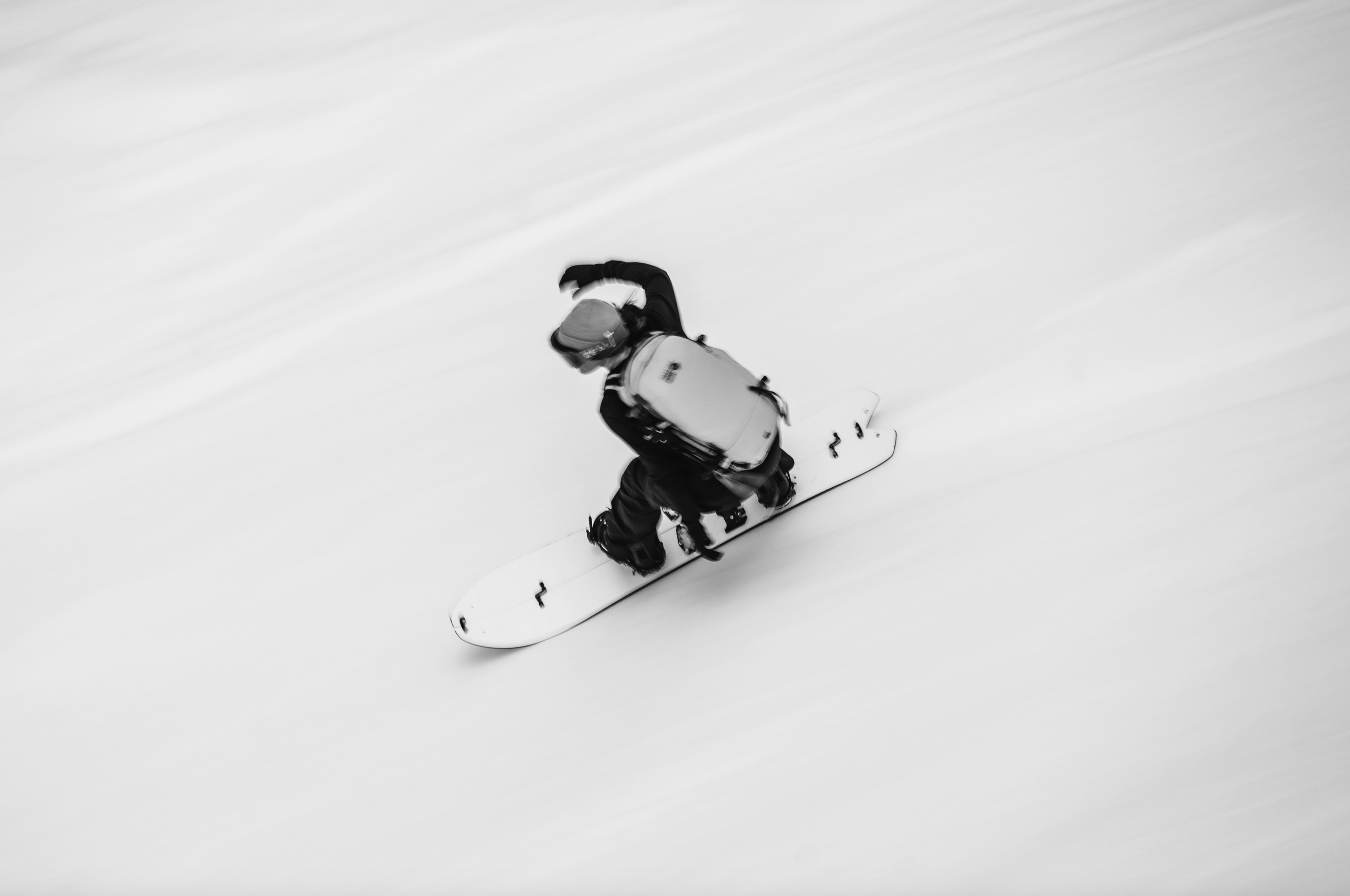 Korua Quill Split Snowboard for snowboarding, showcasing its versatile split design and durable construction in a snowy landscape.