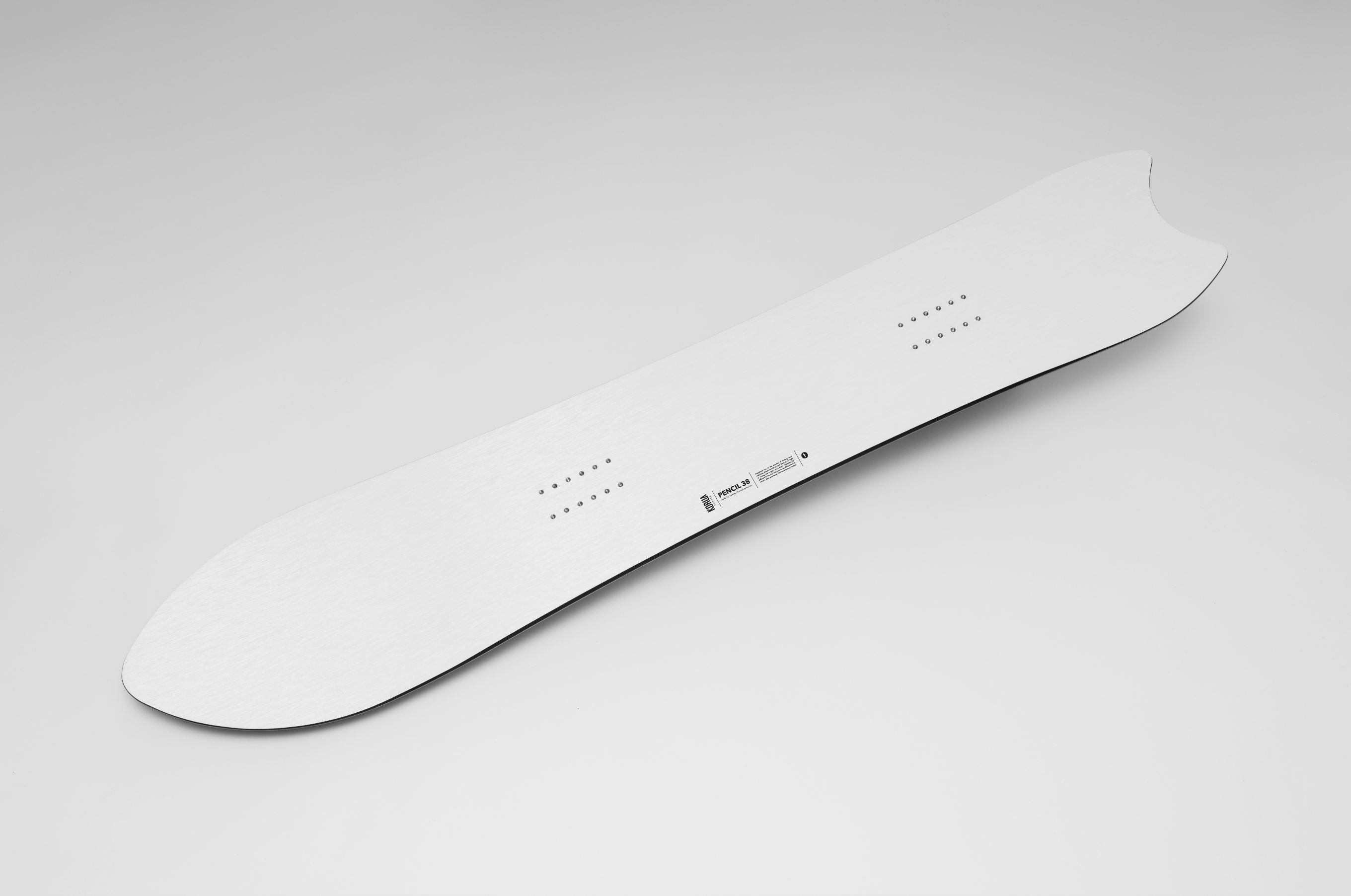 Korua Pencil Junior snowboard with a sleek snow design, featuring the Korua brand logo and detailed graphic artwork.