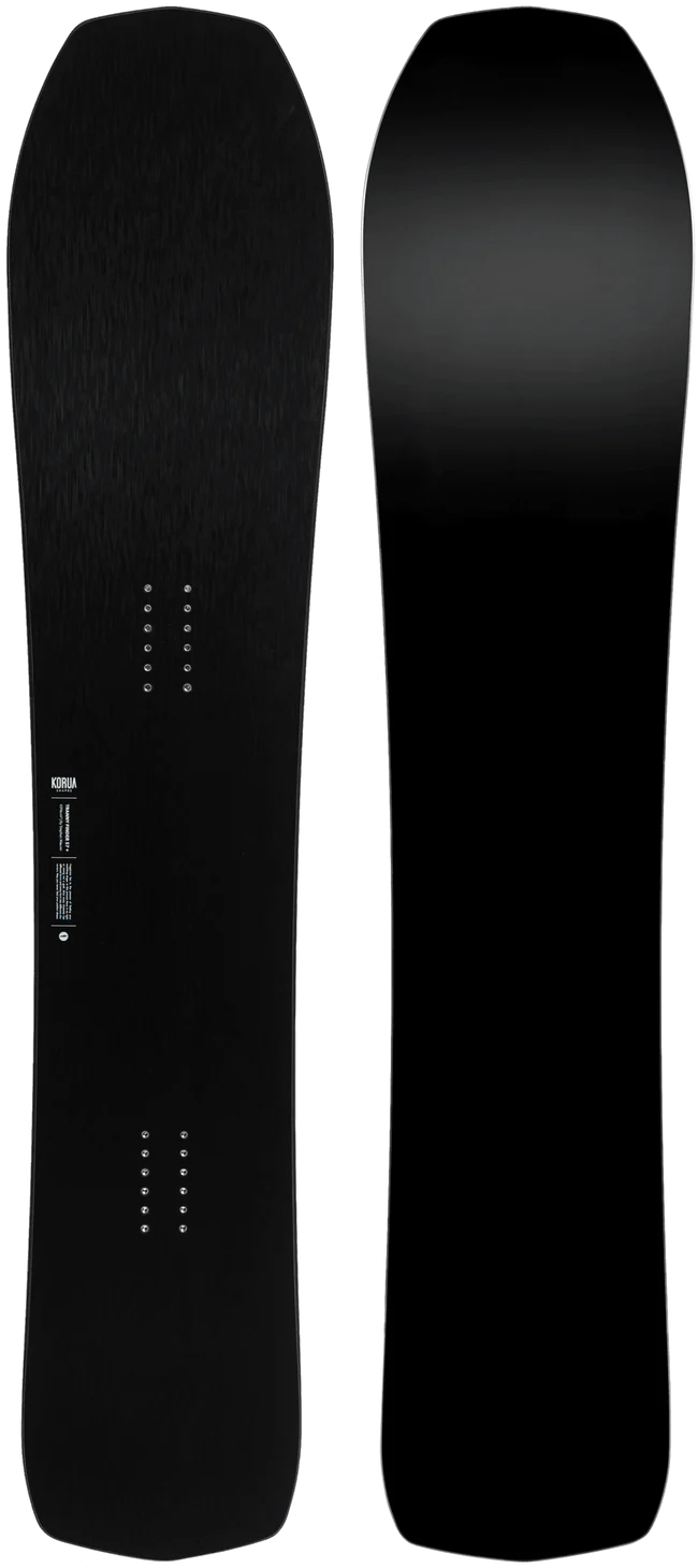 Korua Transition Finder Plus snowboard in snow, showcasing its design and graphics on a winter snow surface.