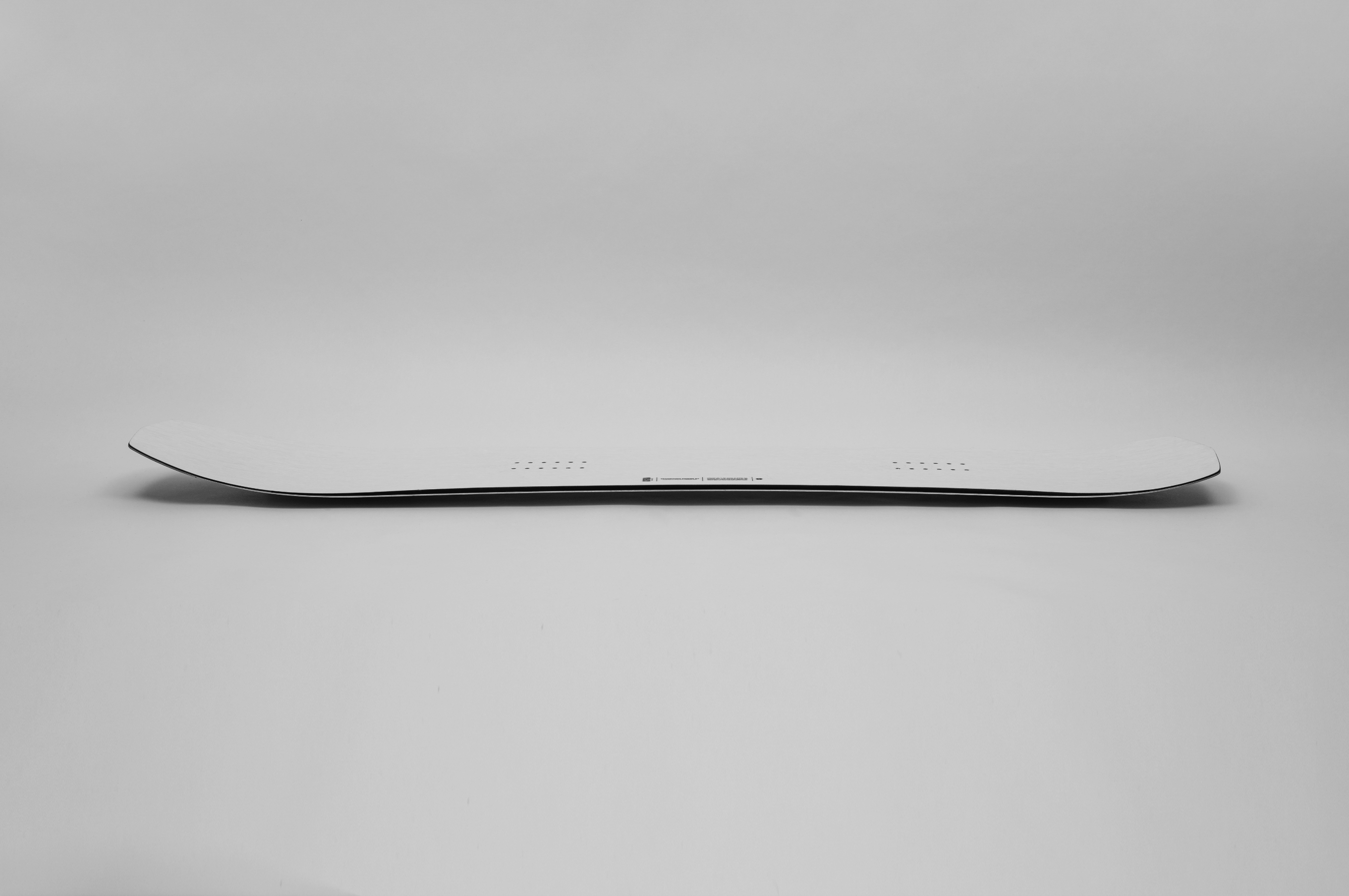 Korua Transition Finder snowboard shown from the side camber view
