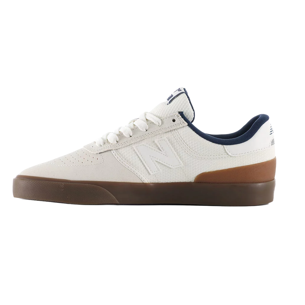 Inner side profile of the New Balance Numeric 272 skate shoe in white and brown with perforated upper and gum vulcanized sole.