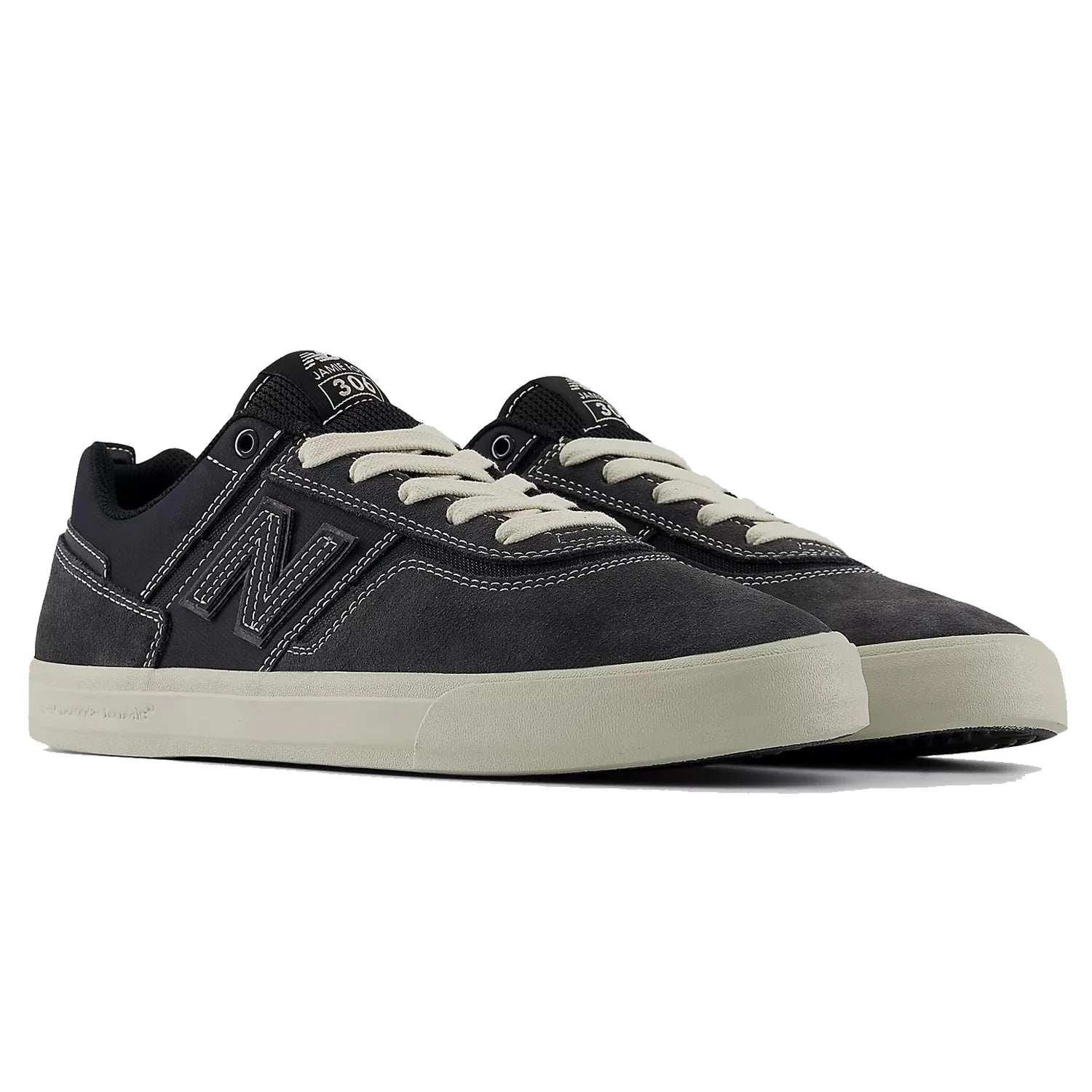 Pair of New Balance Numeric Jamie Foy 306 skate shoes in grey and beige shown from a front three-quarter angle.