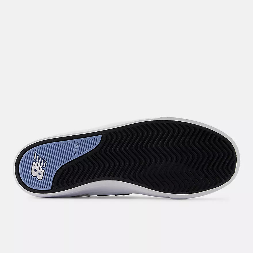 Bottom view of the black rubber outsole and herringbone tread with blue New Balance Numeric heel detail on the Jamie Foy 306 skate shoe.