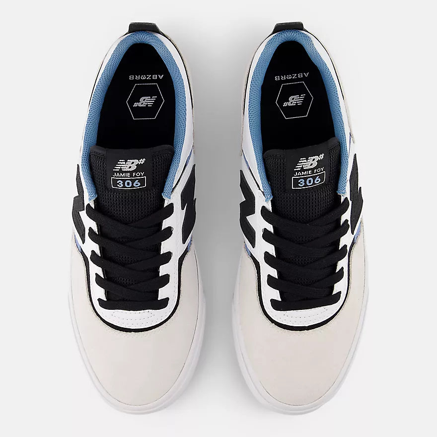 Top view of a pair of New Balance Numeric Jamie Foy 306 skate shoes showing black laces, Jamie Foy 306 tongue labels, blue collars and ABZORB insoles.