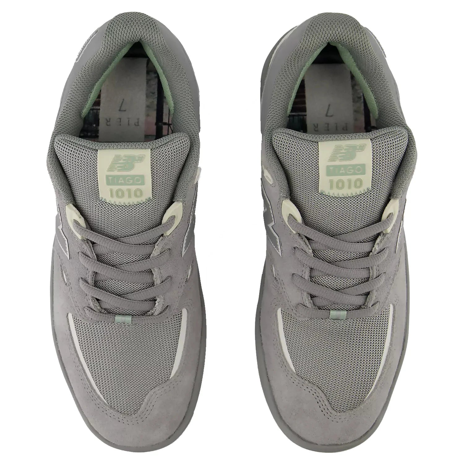 Top view of a pair of New Balance Numeric Tiago 1010 skate shoes showing grey laces, mesh toe boxes and Tiago 1010 tongue labels.