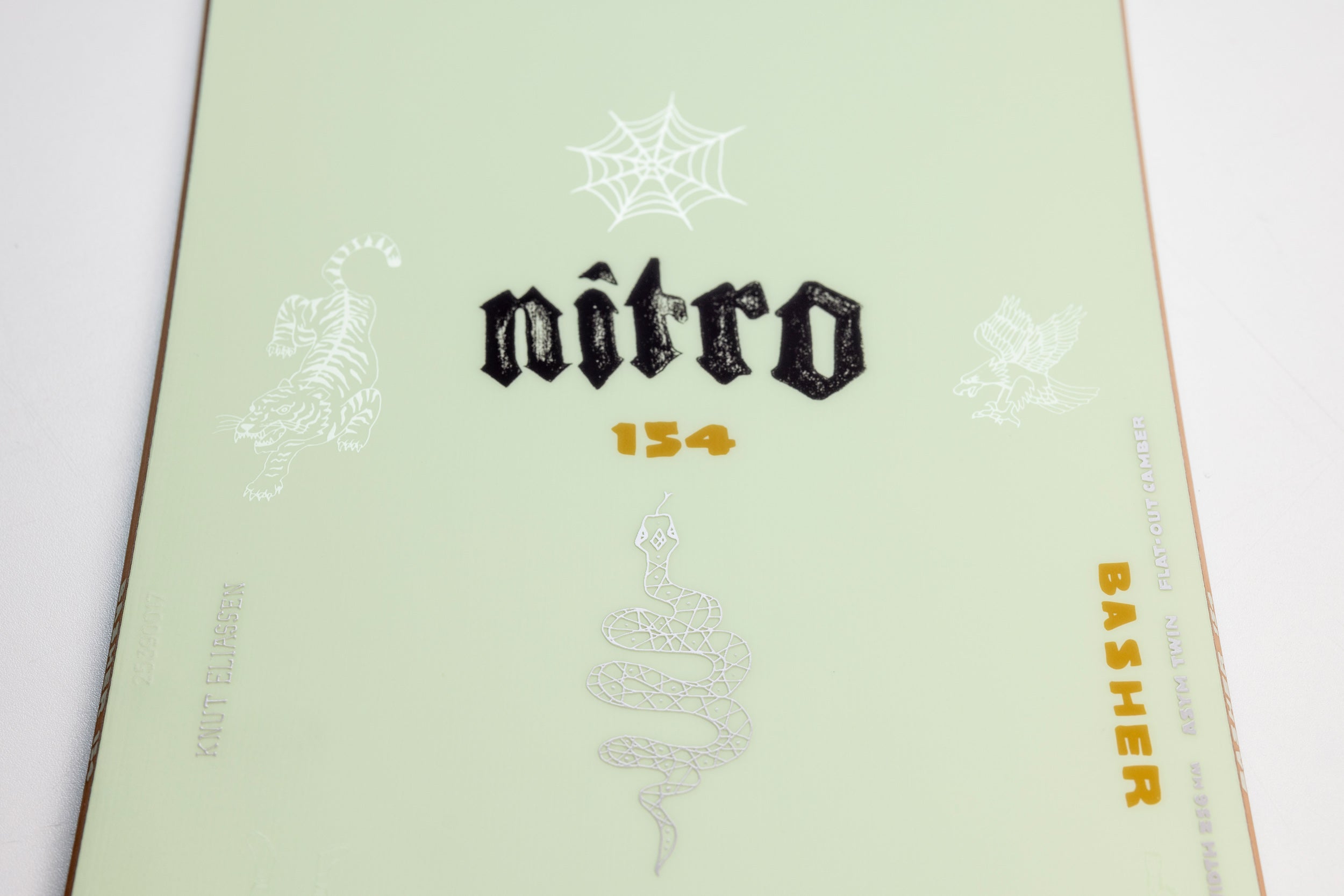 Nitro Basher Quiver Series Snowboard 2027 with bold logo and artwork, designed for snowboarding adventures.