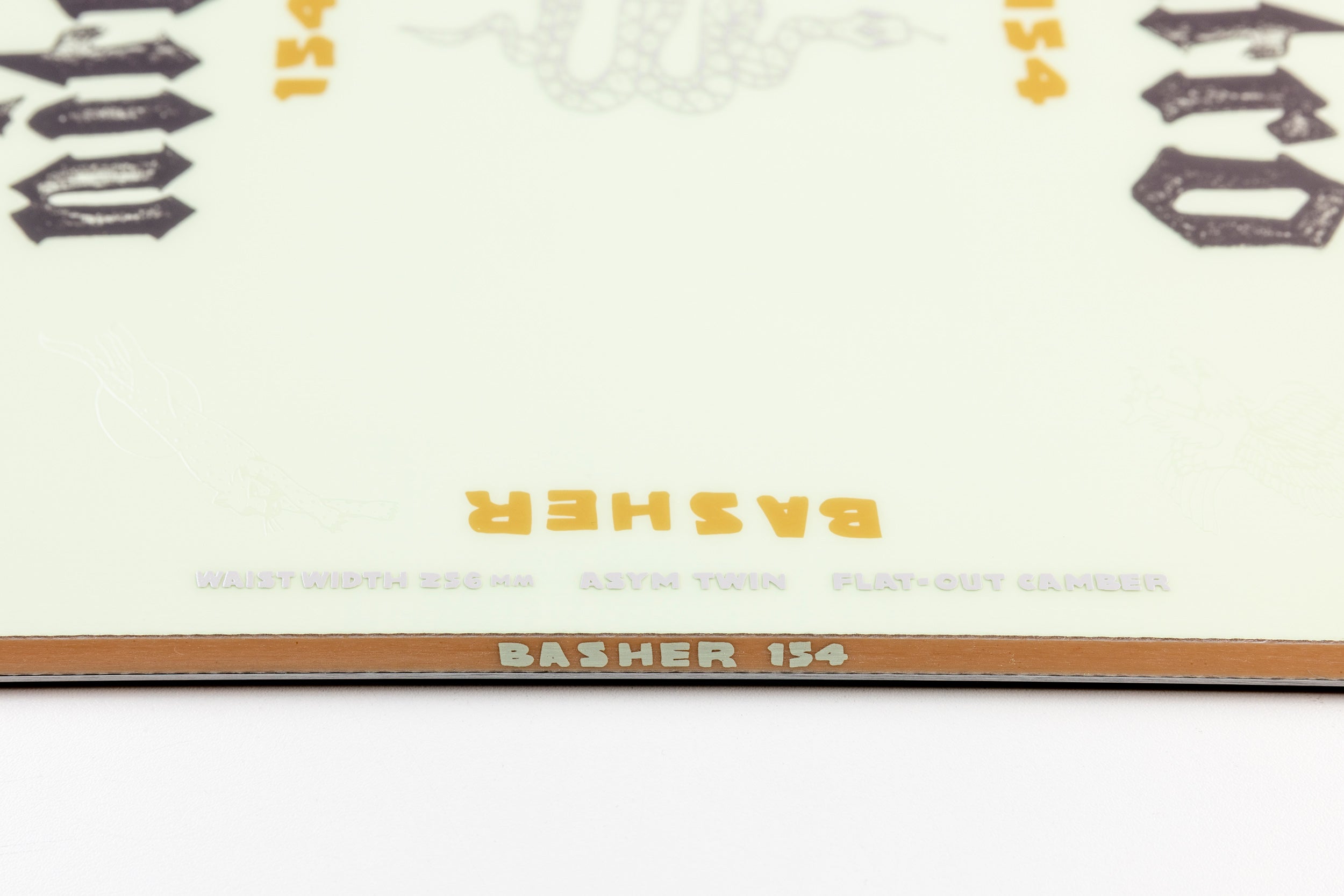 Side view of Nitro Basher Quiver Series Snowboard 2027, showcasing its shape and sidewall design for snowboarding performance.