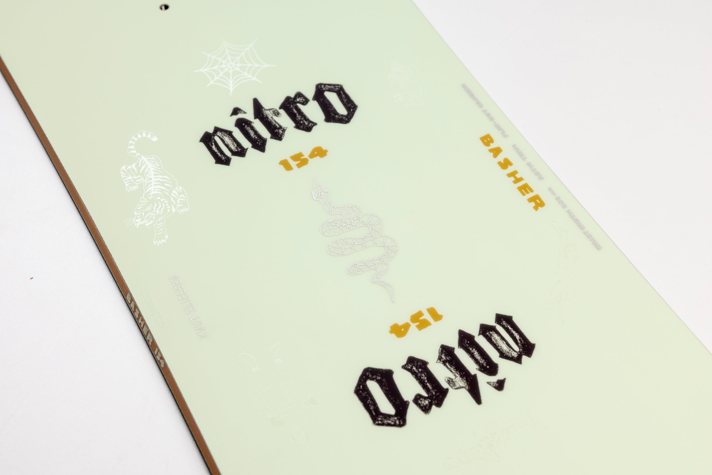 Nitro Basher Quiver Series Snowboard 2027 top sheet with branding and graphic details, designed for snowboarding enthusiasts.