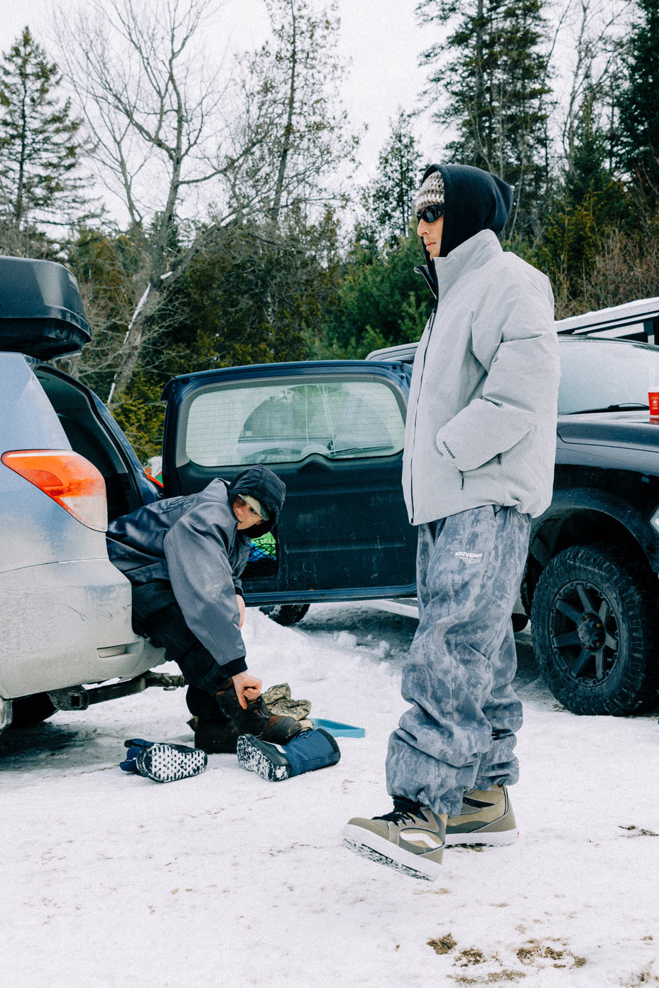 Souvenir Parachute Pant 2027 shown in a winter lifestyle setting highlighting the oversized technical snow pant fit.