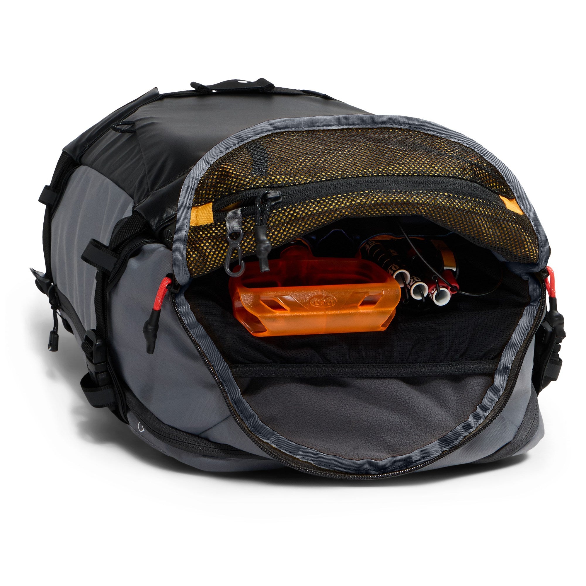 Open top compartment of The North Face Slackpack 30 snow backpack showing internal mesh storage and organization for snow gear and accessories.
