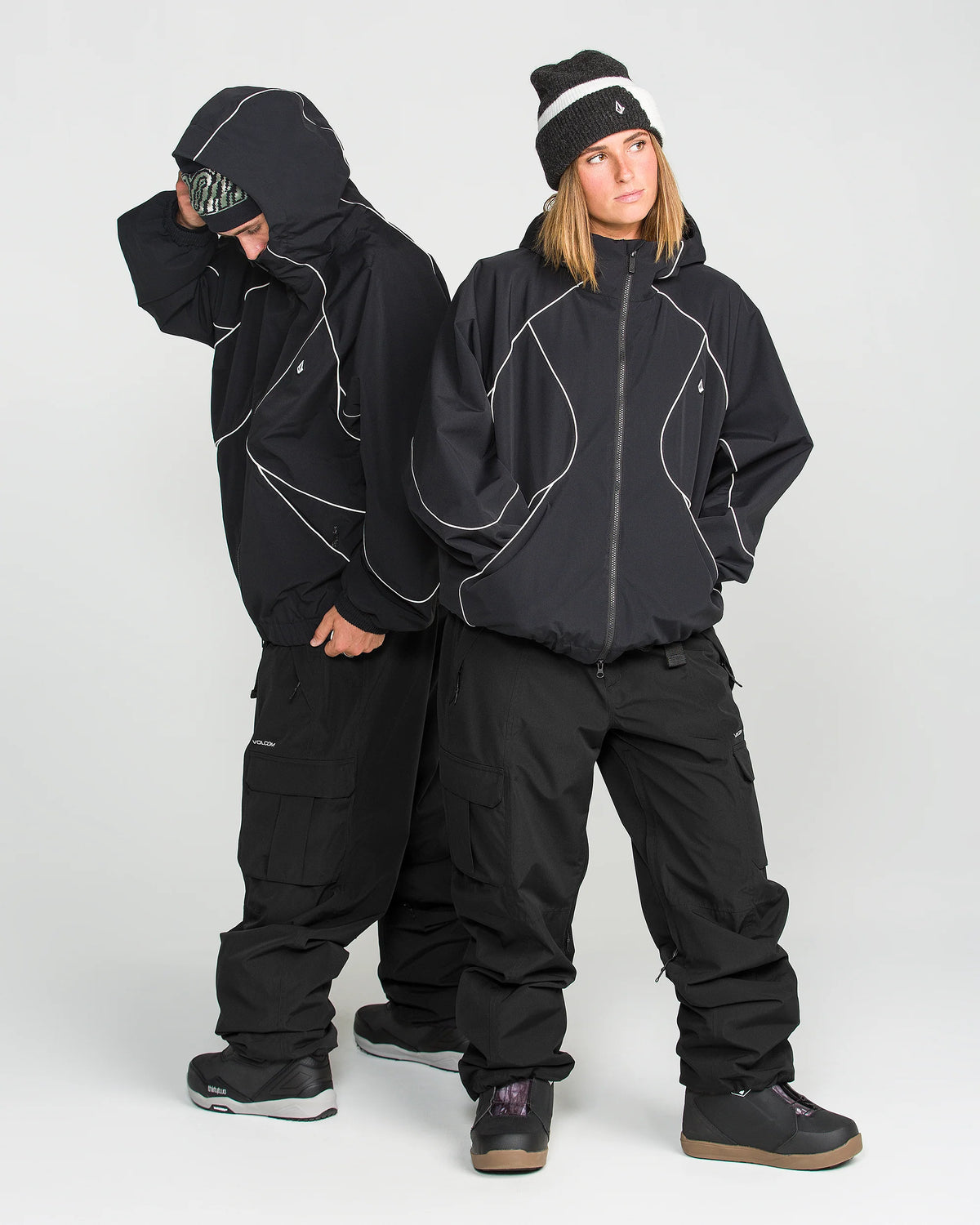 Volcom Liftline 20K Pant 2027 in Black shown on-body with an oversized snowboard jacket, highlighting the extra-baggy fit and cargo styling.