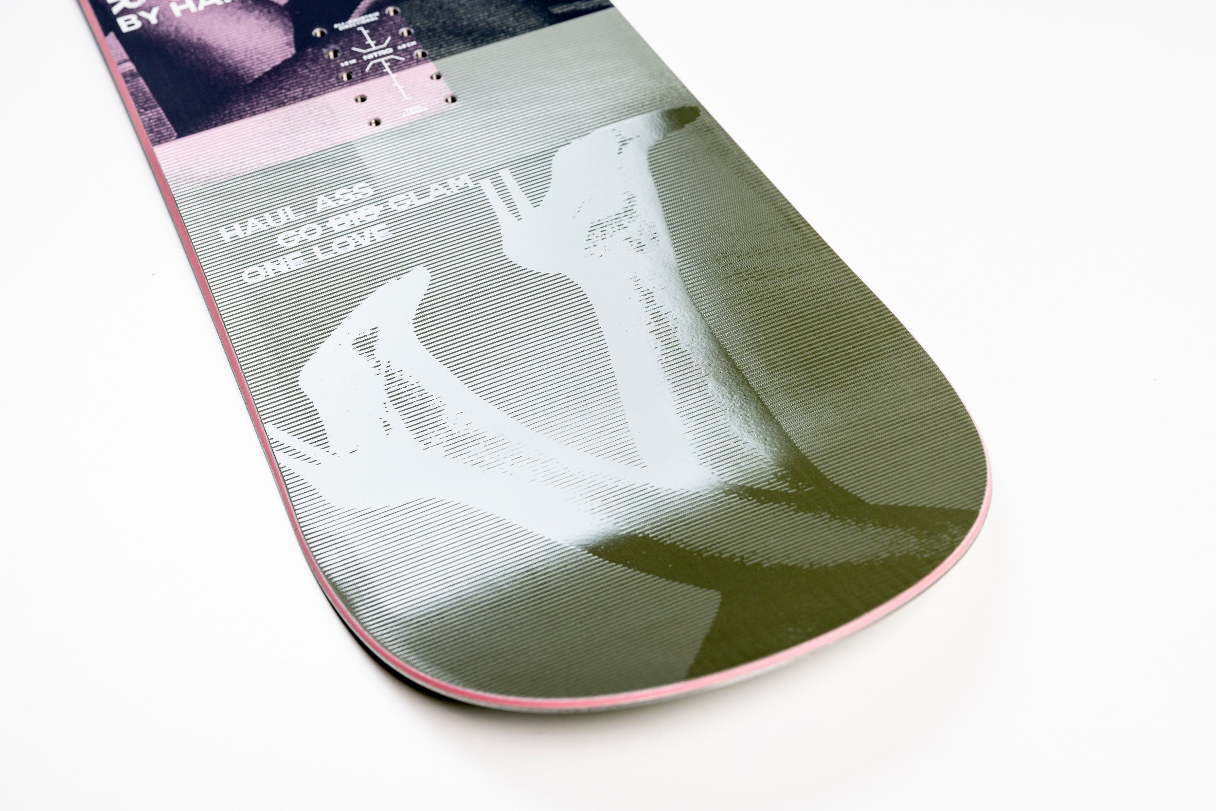 Nitro Alternator X Hailey women's snowboard in snow, featuring a detailed view of the Nitro brand and snowboard design.