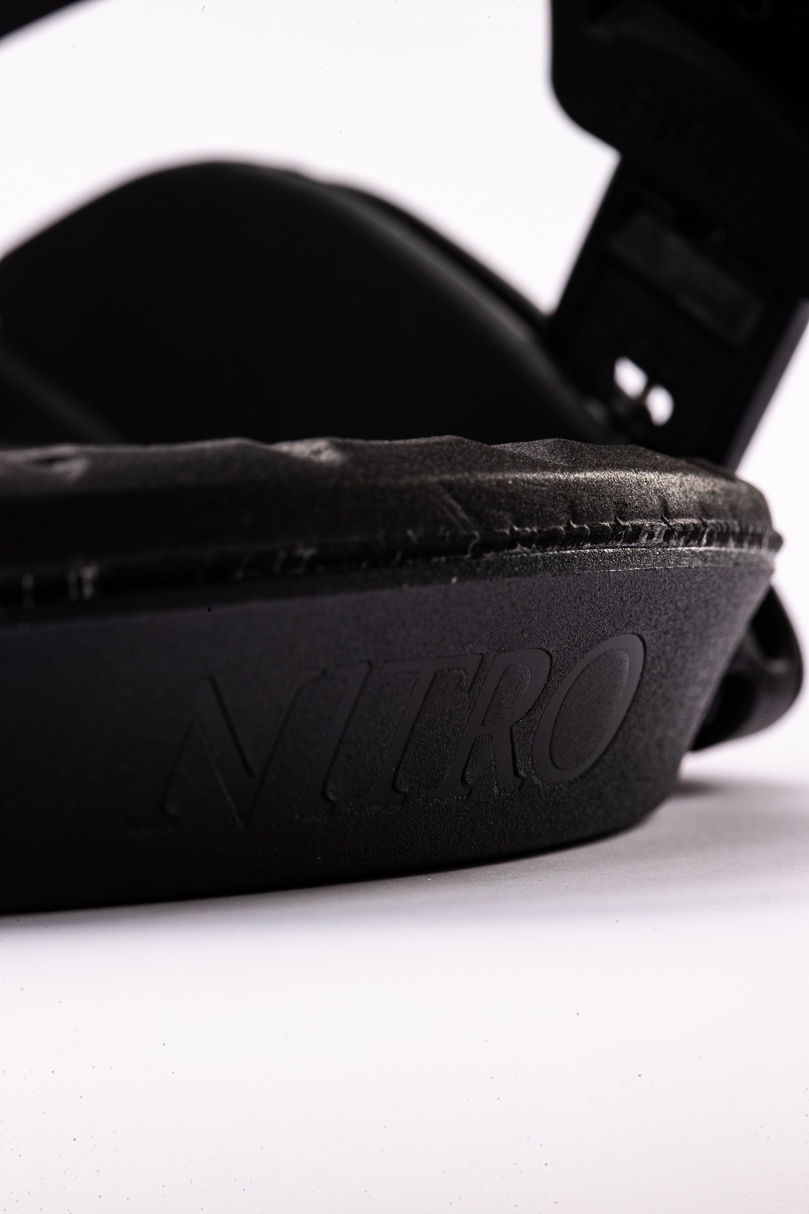Black Nitro Fate snowboard bindings with logo detail, designed for snowboarding in the 2027 season.