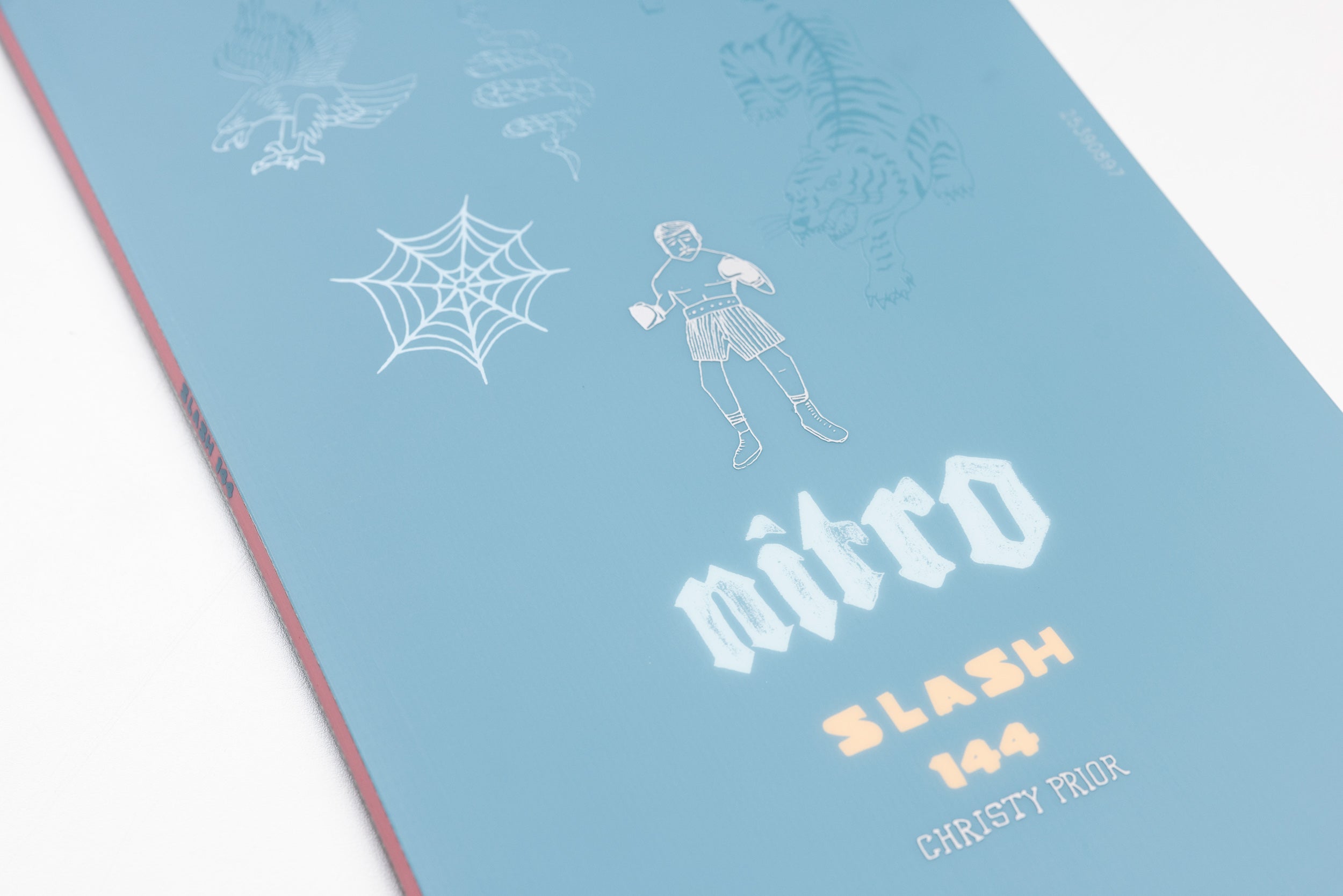 Nitro Slash Quiver Series snowboard 2027 with bold graphic design, shown in a natural snow setting, ideal for versatile snowboarding.