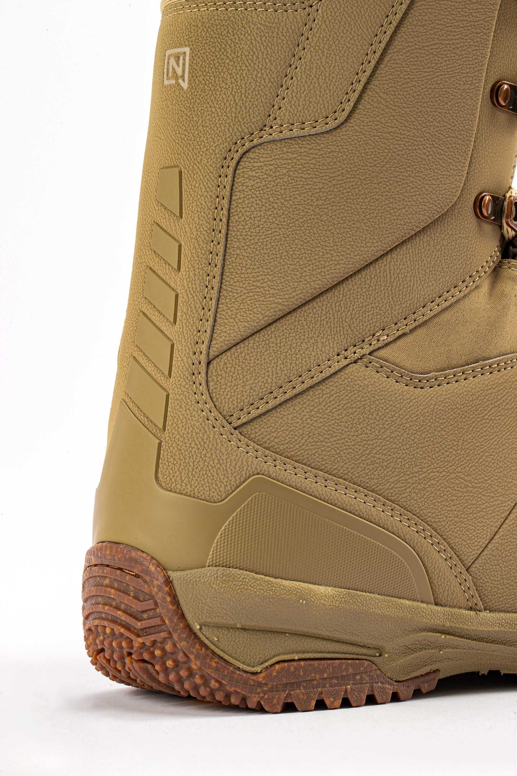 Brown Nitro Venture Pro Lace Snowboard Boots with padded collar and grip sole, designed for snowboarders in 2027.