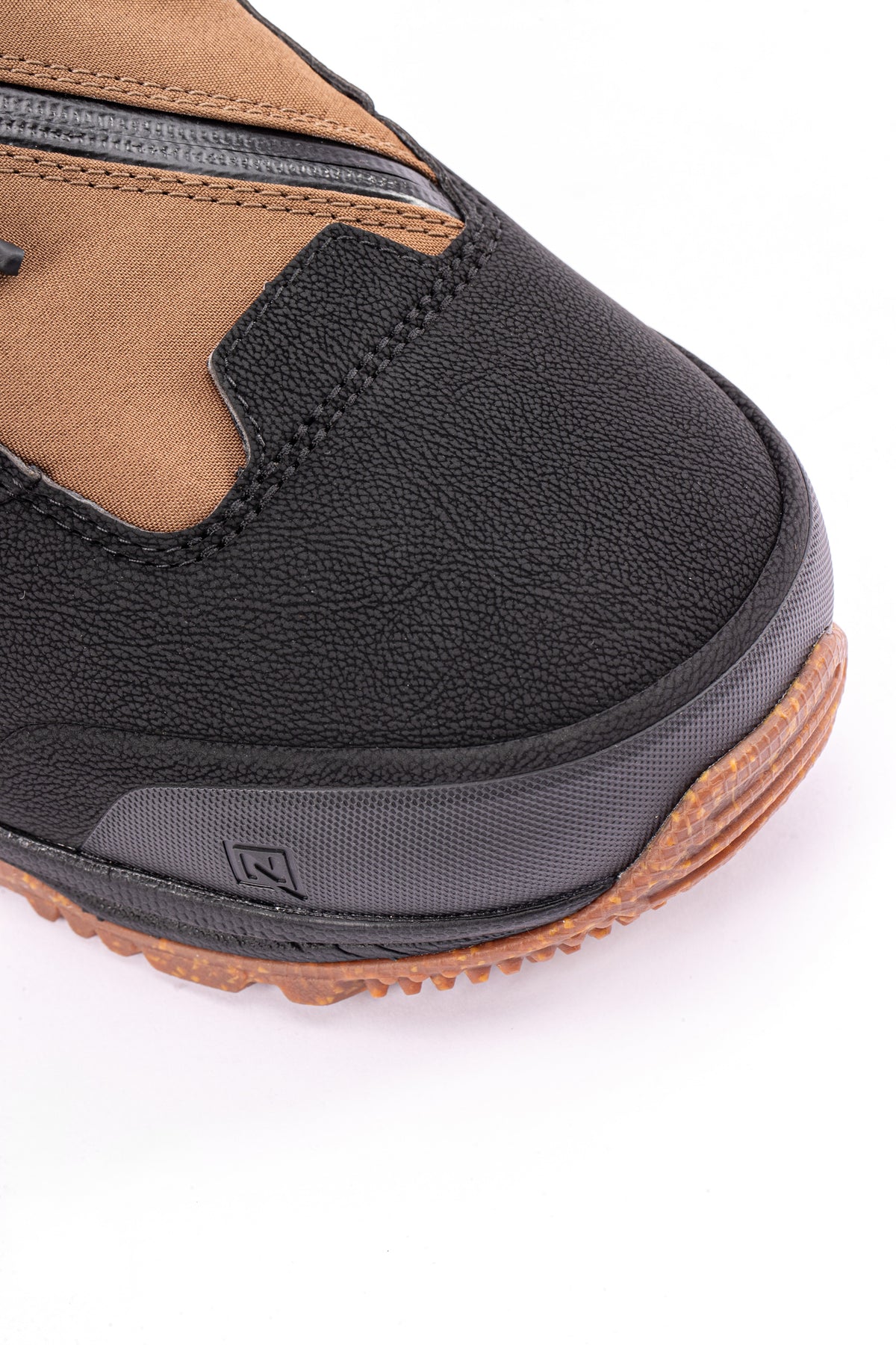 Brown and black Nitro Venture Pro TLS snowboard boots for snowboarding, featuring secure lacing and rugged design.