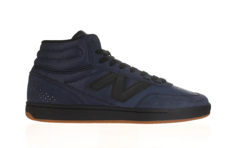 New Balance Numeric 440 High V2 skate shoes in indigo and black with padded collar and durable rubber sole.