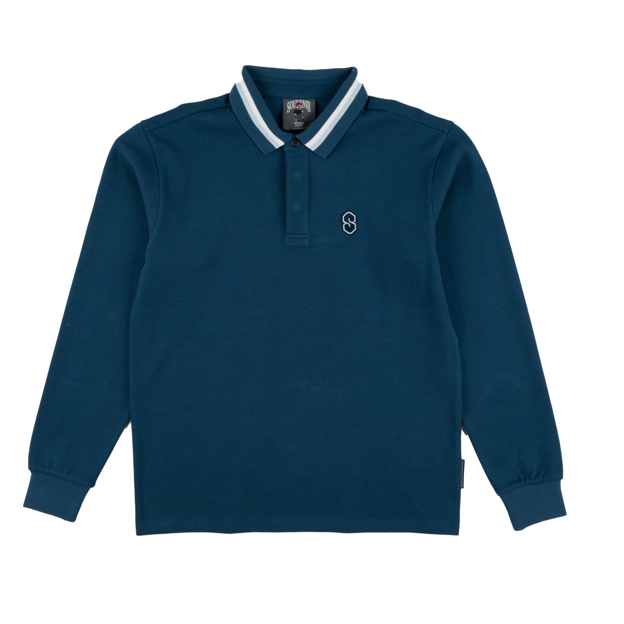 A dark blue long sleeve shirt with a white and navy striped collar, featuring a small white embroidered souvenir logo on the left chest, displayed on a clean white background.