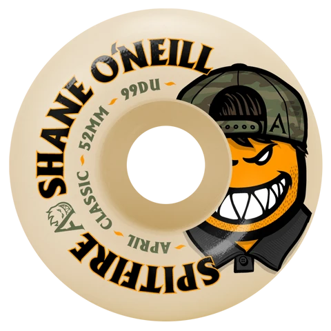 A single beige skateboard wheel with printed graphics and text. The wheel features the text 'SHANE O'NEILL SPITIFIRE APRIL 52MM 99DU' in black and olive green, alongside a cartoon character wearing a camouflage cap and black jacket with an orange face.