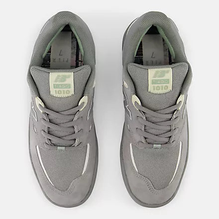 New Balance Numeric Tiago 1010 skate shoes in grey and white with a sleek design and supportive sole.