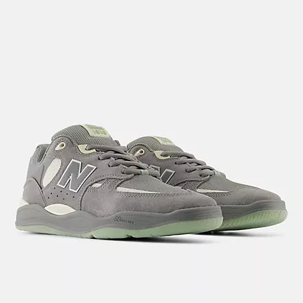 New Balance Numeric Tiago 1010 skate shoes in grey and white with sleek design and durable construction.