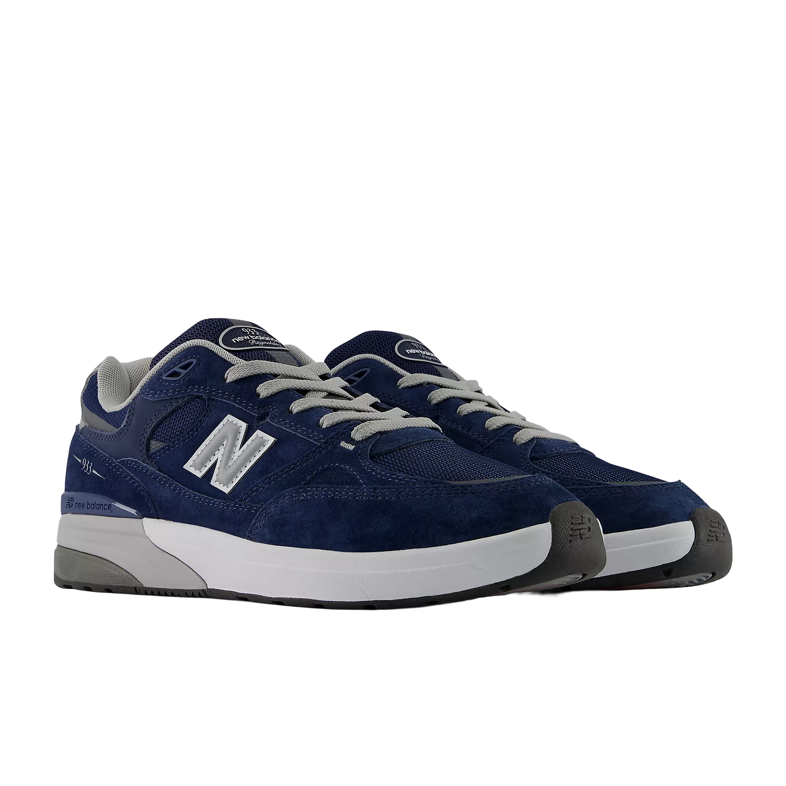 New Balance Numeric Andrew Reynolds 933 skate shoes in navy and slate grey with white accents, showing side view and textured sole.