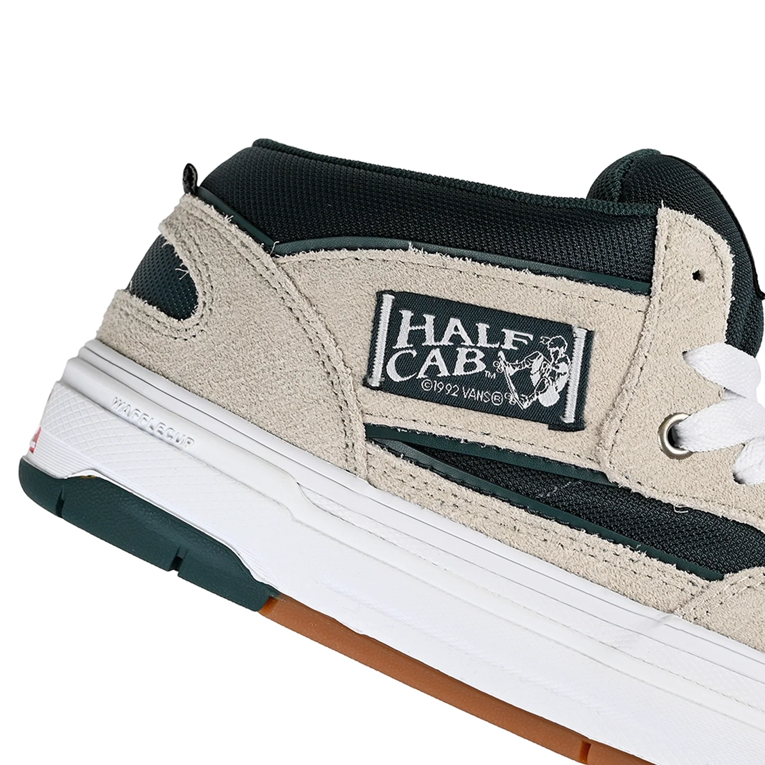 Vans Skate Half Cab Wafflecup shoes in oatmeal and deep teal with skateboarding design and durable rubber sole.