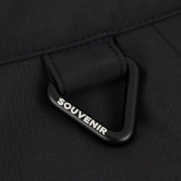 Black men's Souvenir 3 Ply Rip Stop Pant with detail carabiner, durable fabric and tactical design for outdoor activities.